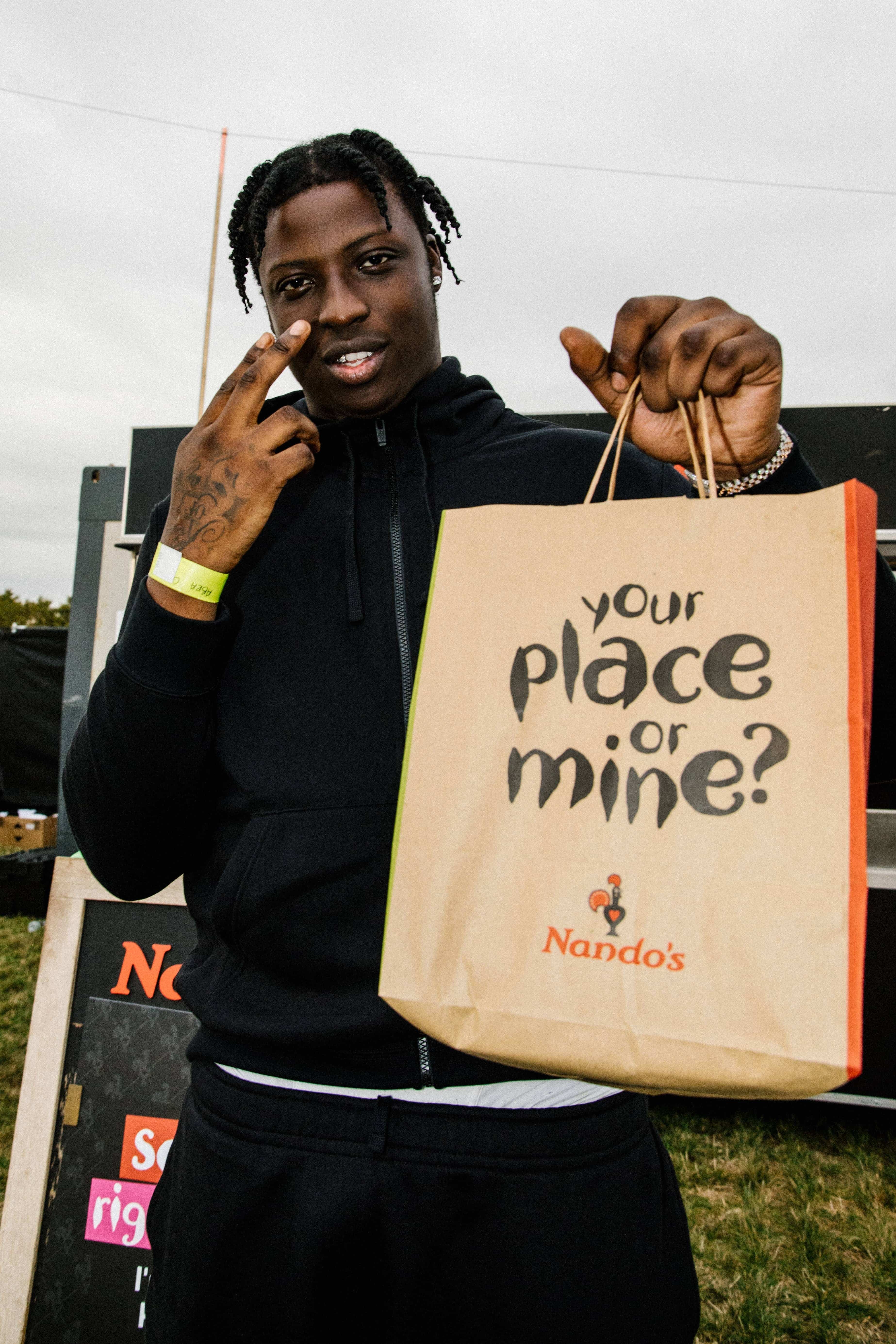 British rapper Abra Cadabra caught fuelling up on Nandos PE Ri PE Ri before his performance at Strawberries and Creem Festival