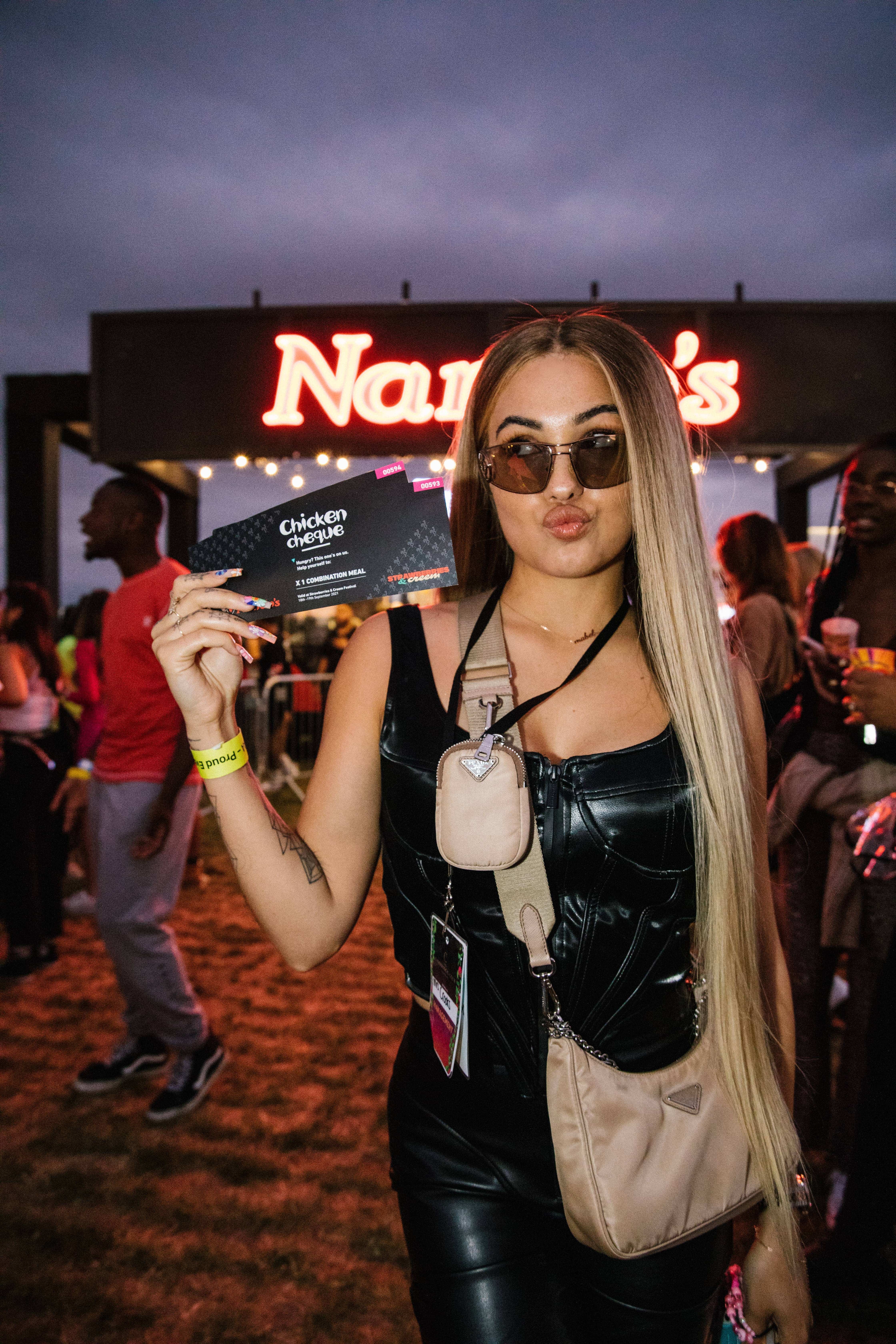 Pop princess Mabel caught just before cashing in her Nandos chicken cheque backstage at Strawberries and Creem Festival