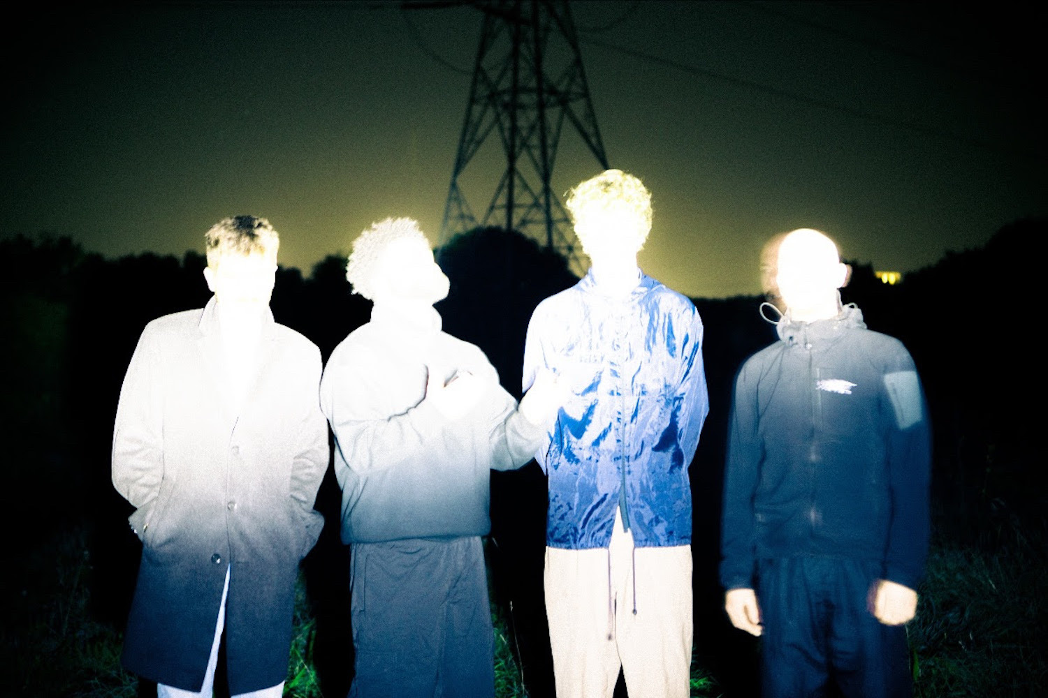 404 Guild overexposed faces pylon at night