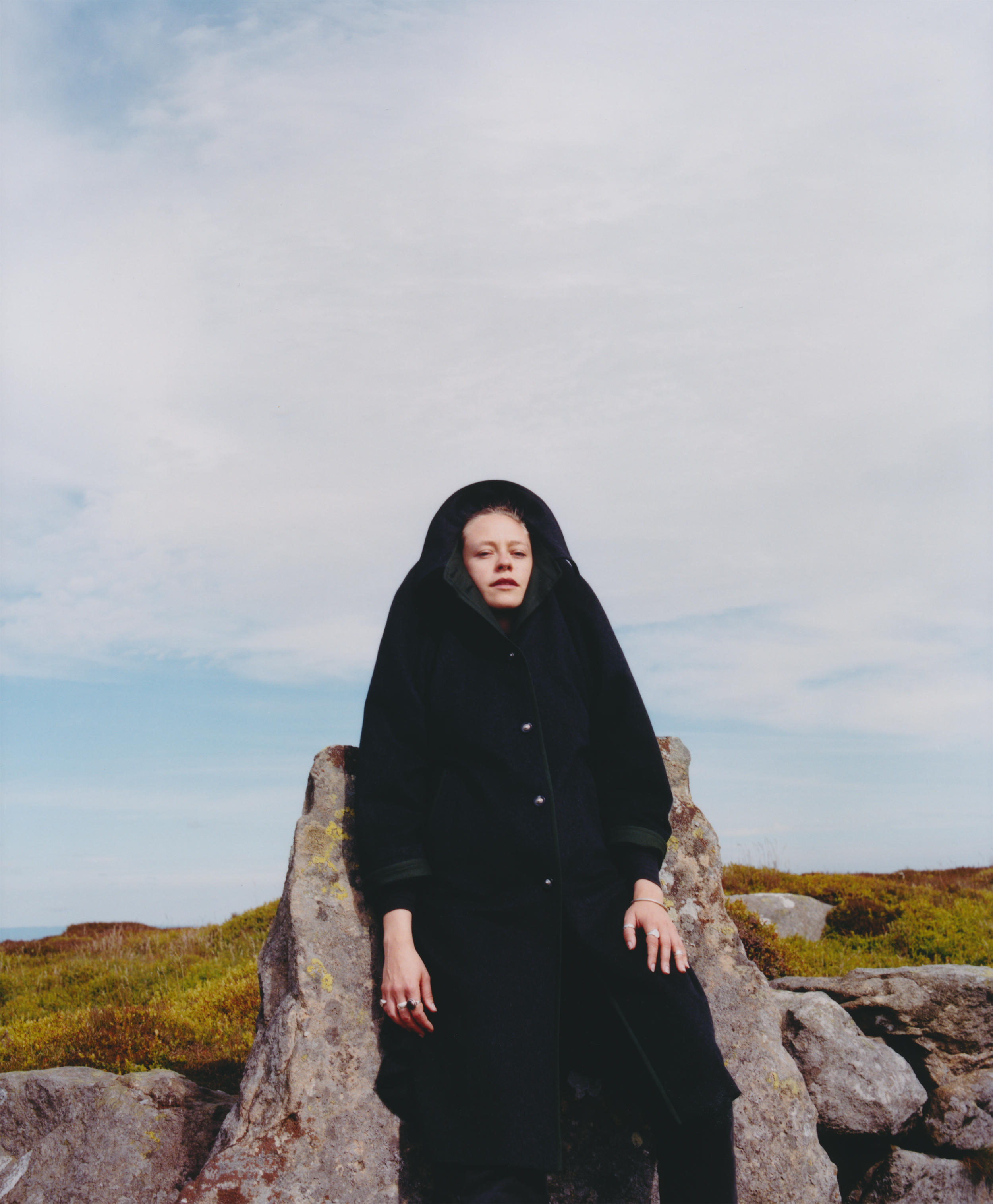 Anna B Savage in black coat