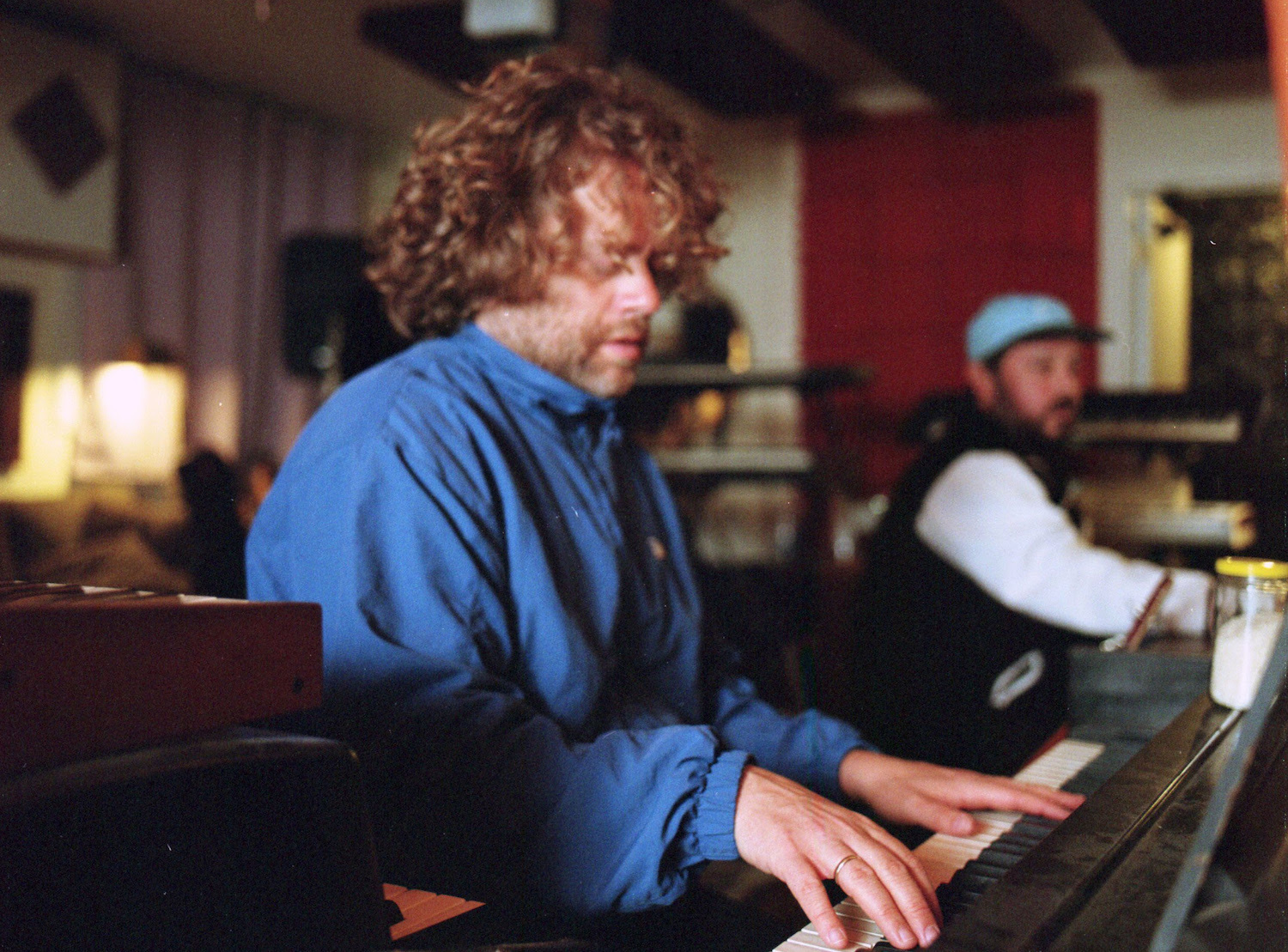 Benny Sings blue shirt on keys