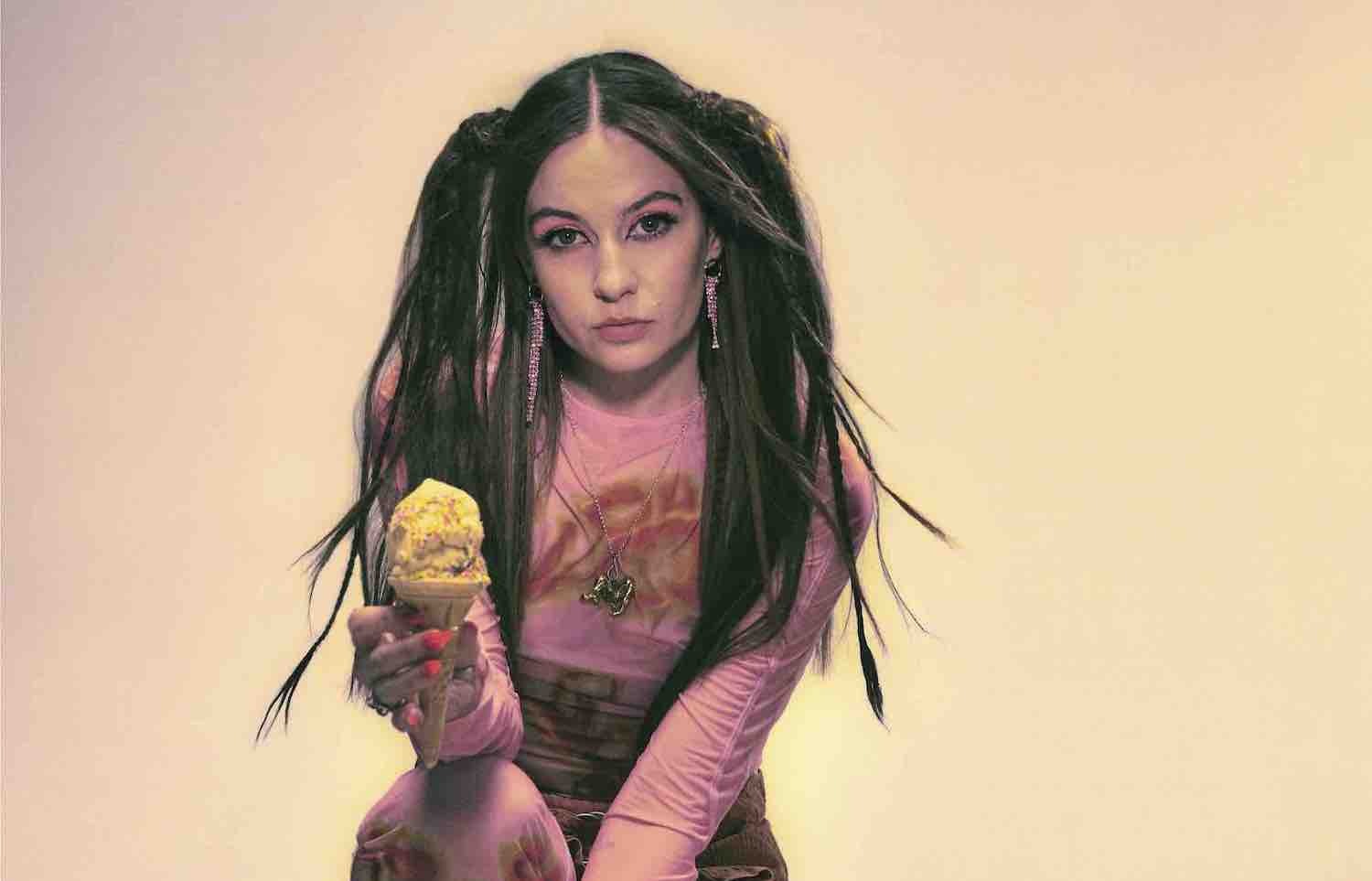 Biig Piig holding ice cream wearing pink