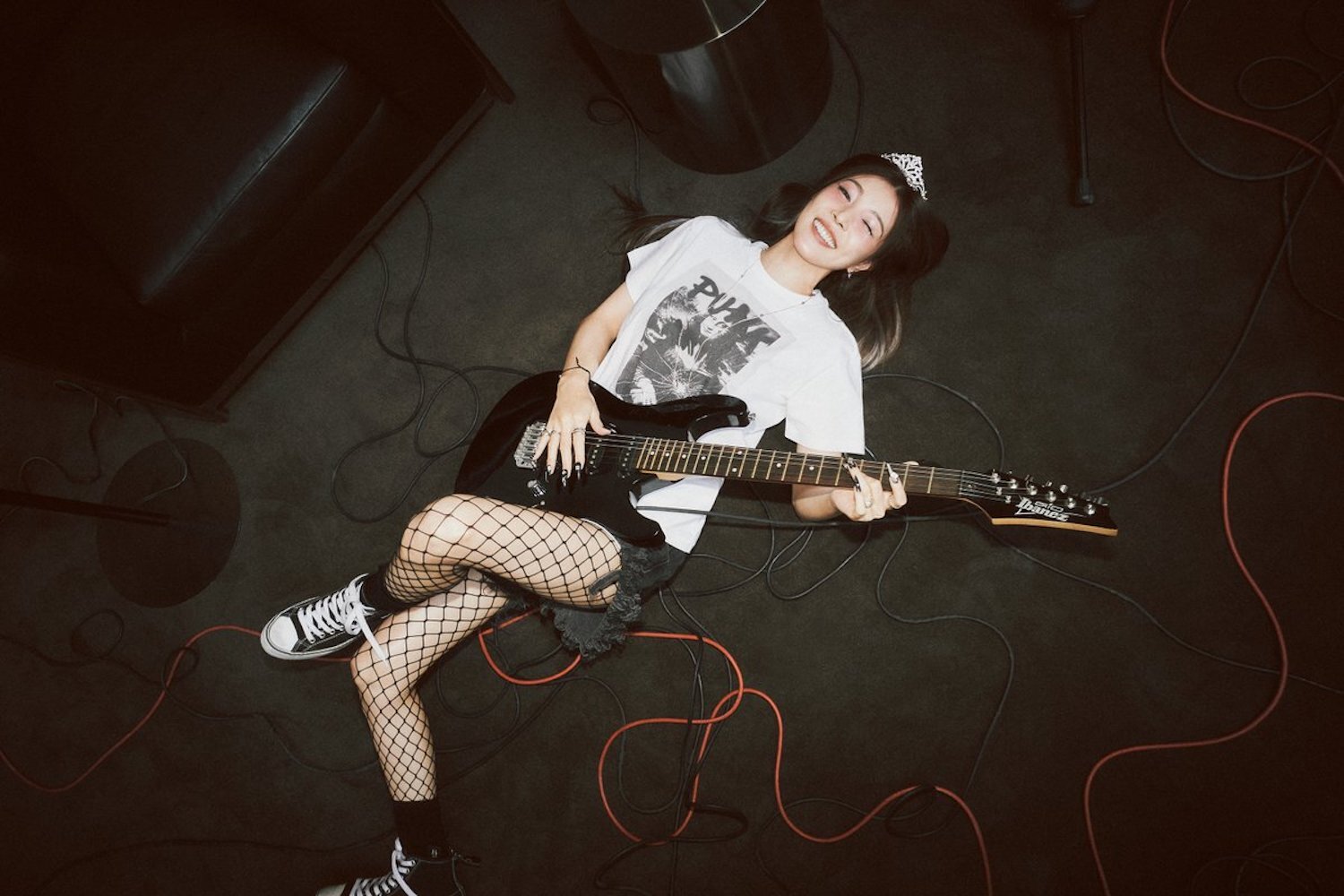 BoA lying on floor with guitar