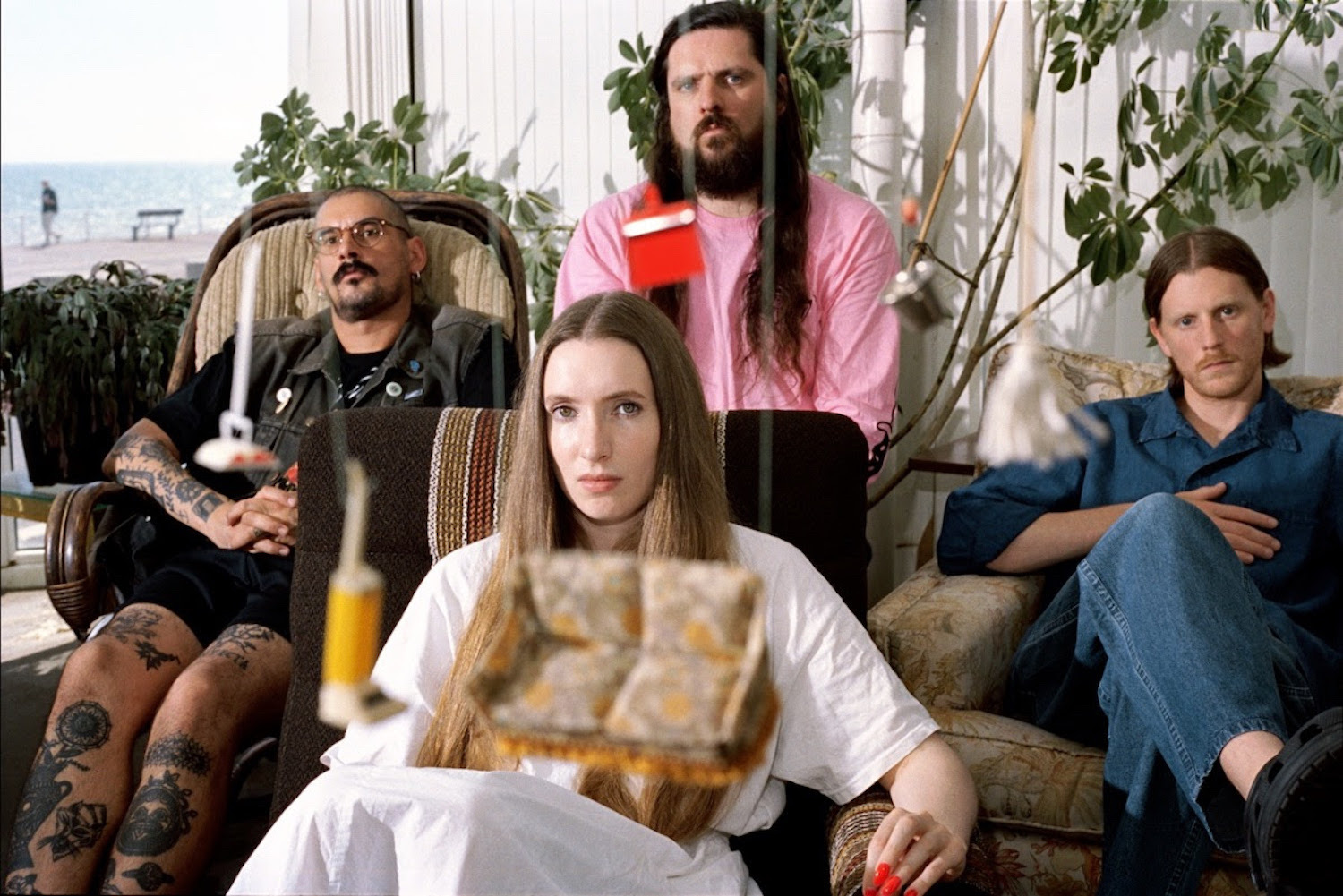 Dry Cleaning with hanging miniature household items for "No Decent Shoes For Rain"