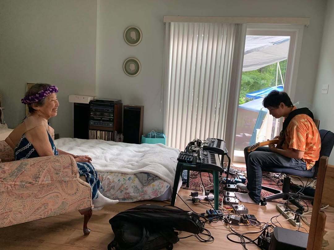 Dustin playing music for Gloria