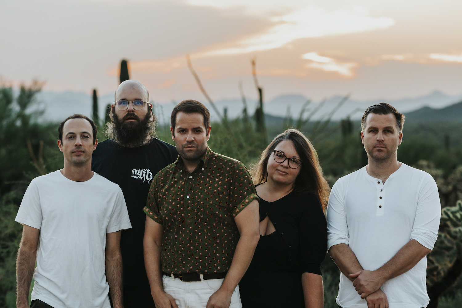 Fucked Up outdoor group shot orange sky
