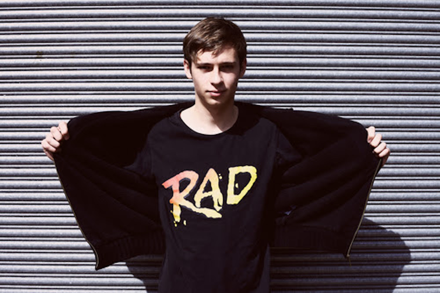 Flume RAD t shirt in front of shutter