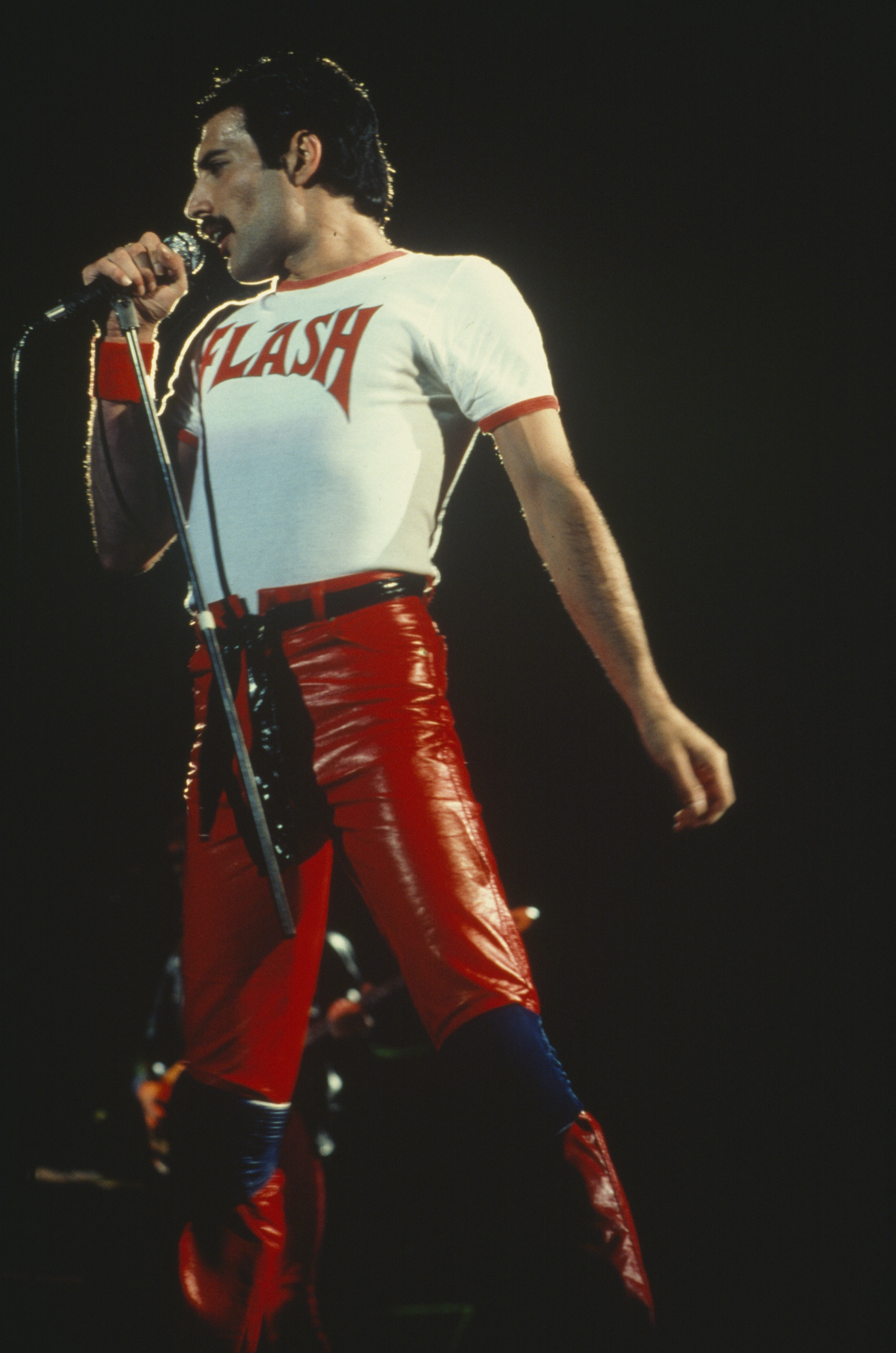 Freddie Mercury performs wearing a Flash t shirt at Sports Arena in San Diego California United States 5th July 1980 Photo by David Tan Shinko Music Getty Images