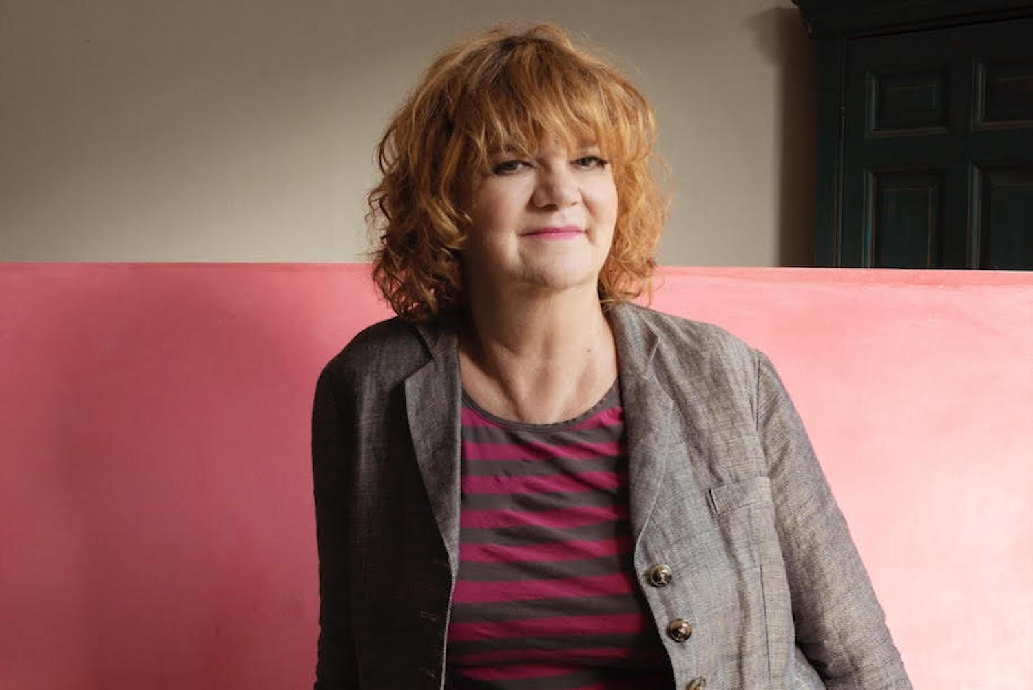 Gina Birch stripy outfit pink backdrop