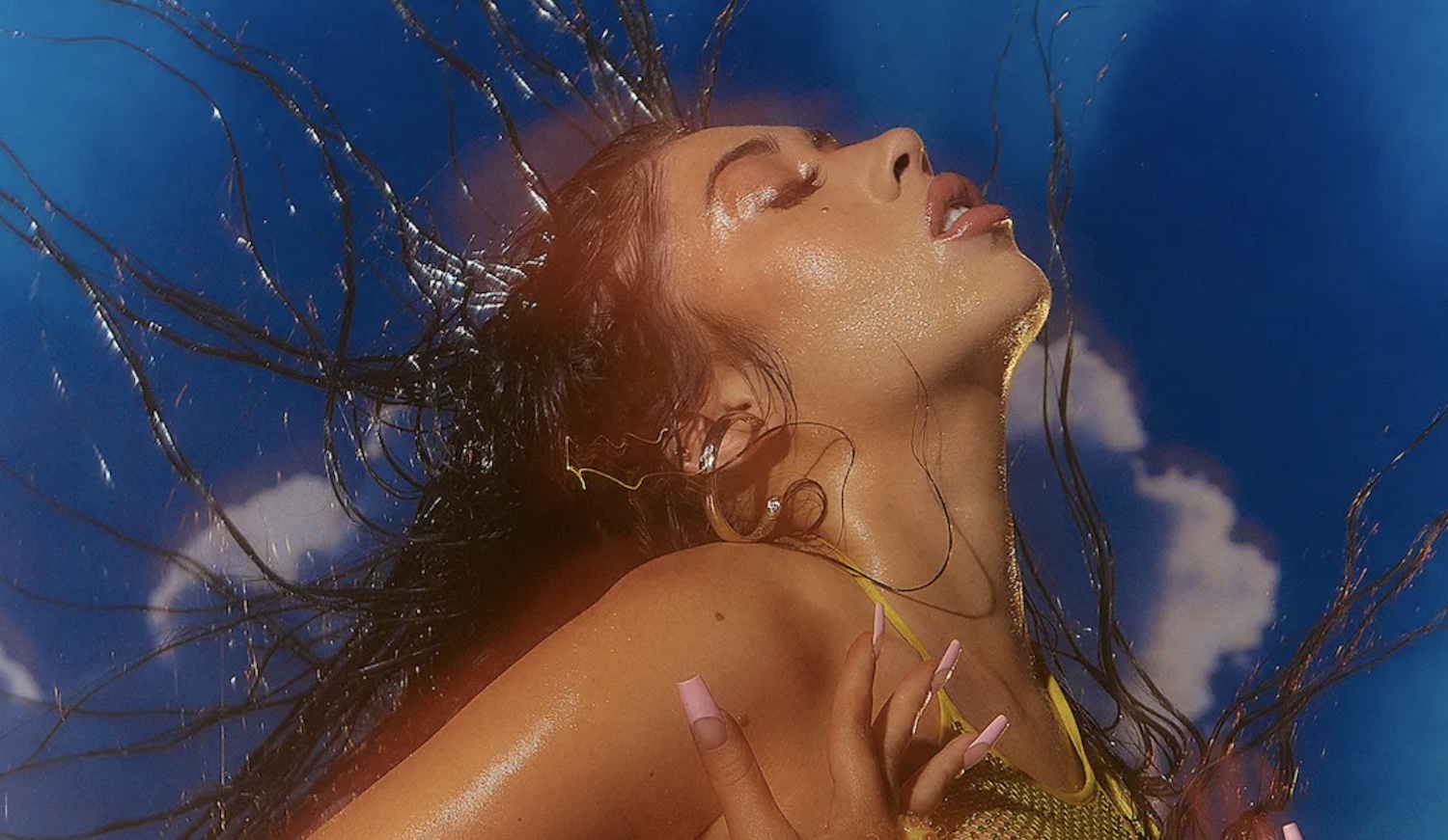 Kali Uchis No Hay Ley wet hair flick sun