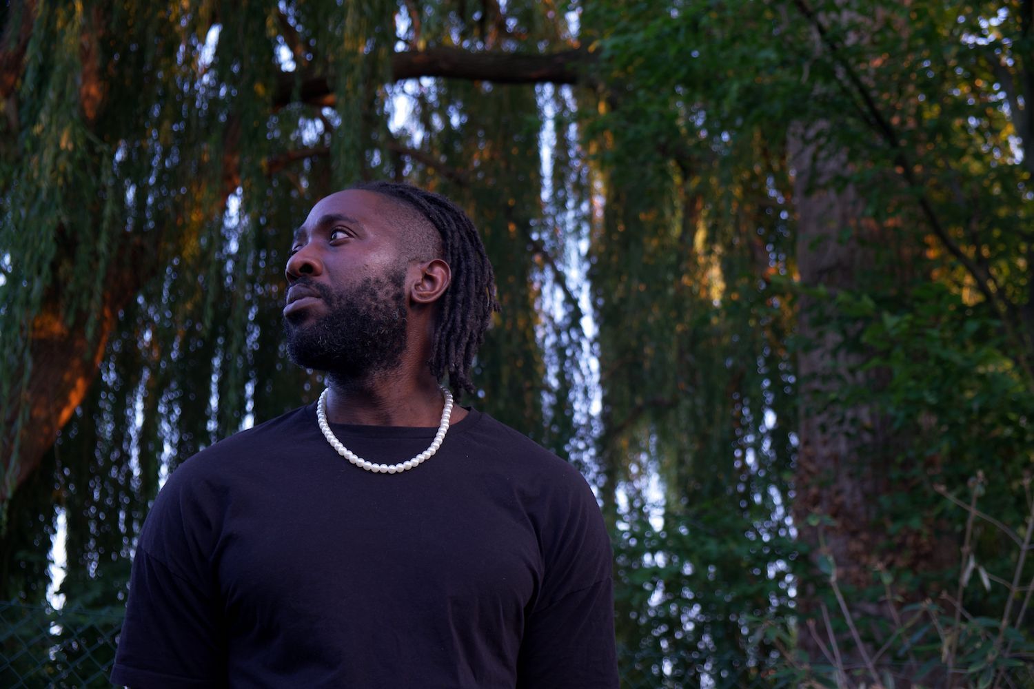 Kele stood in front of tree