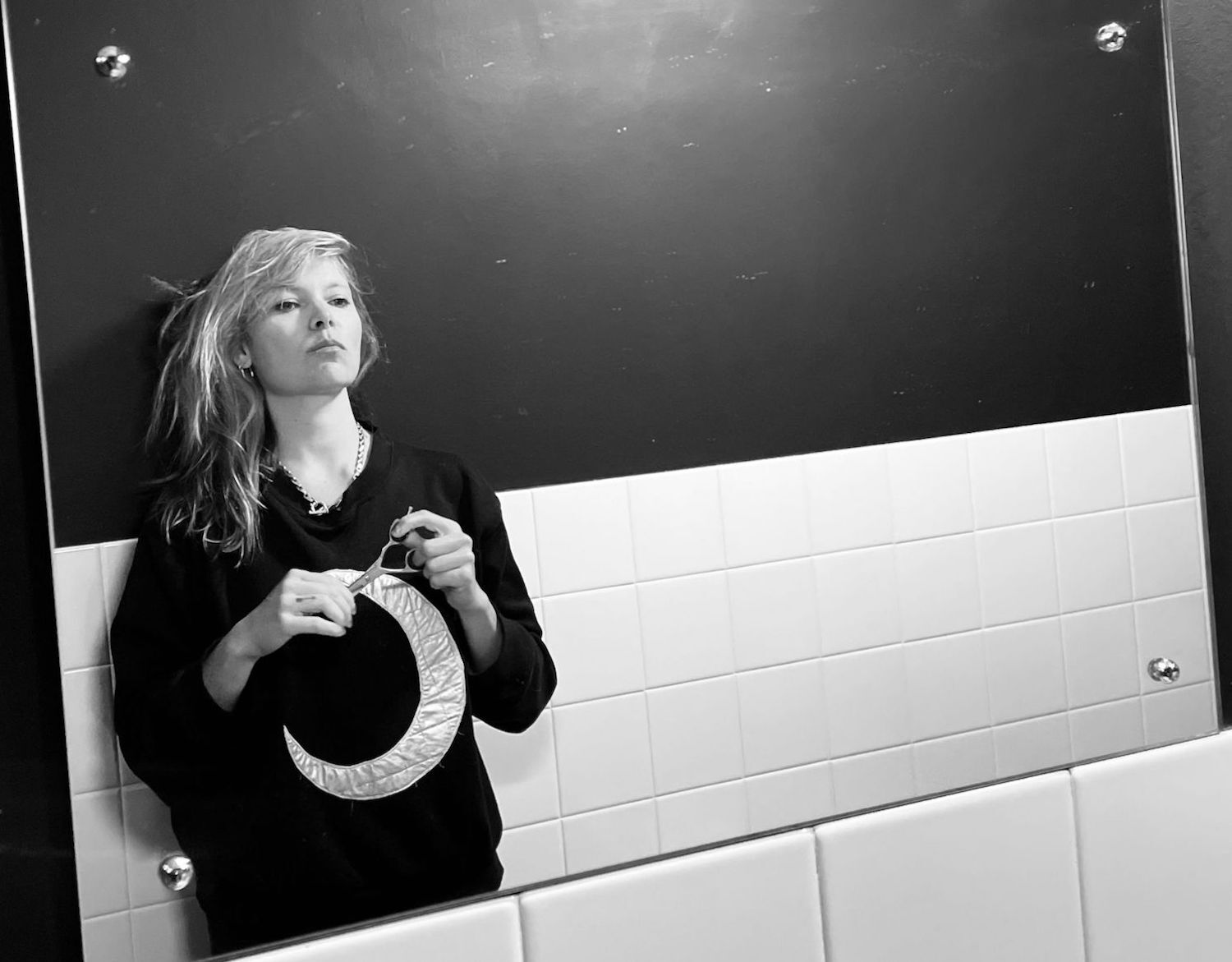 Liela Moss holding crescent moon prop monochrome 2022