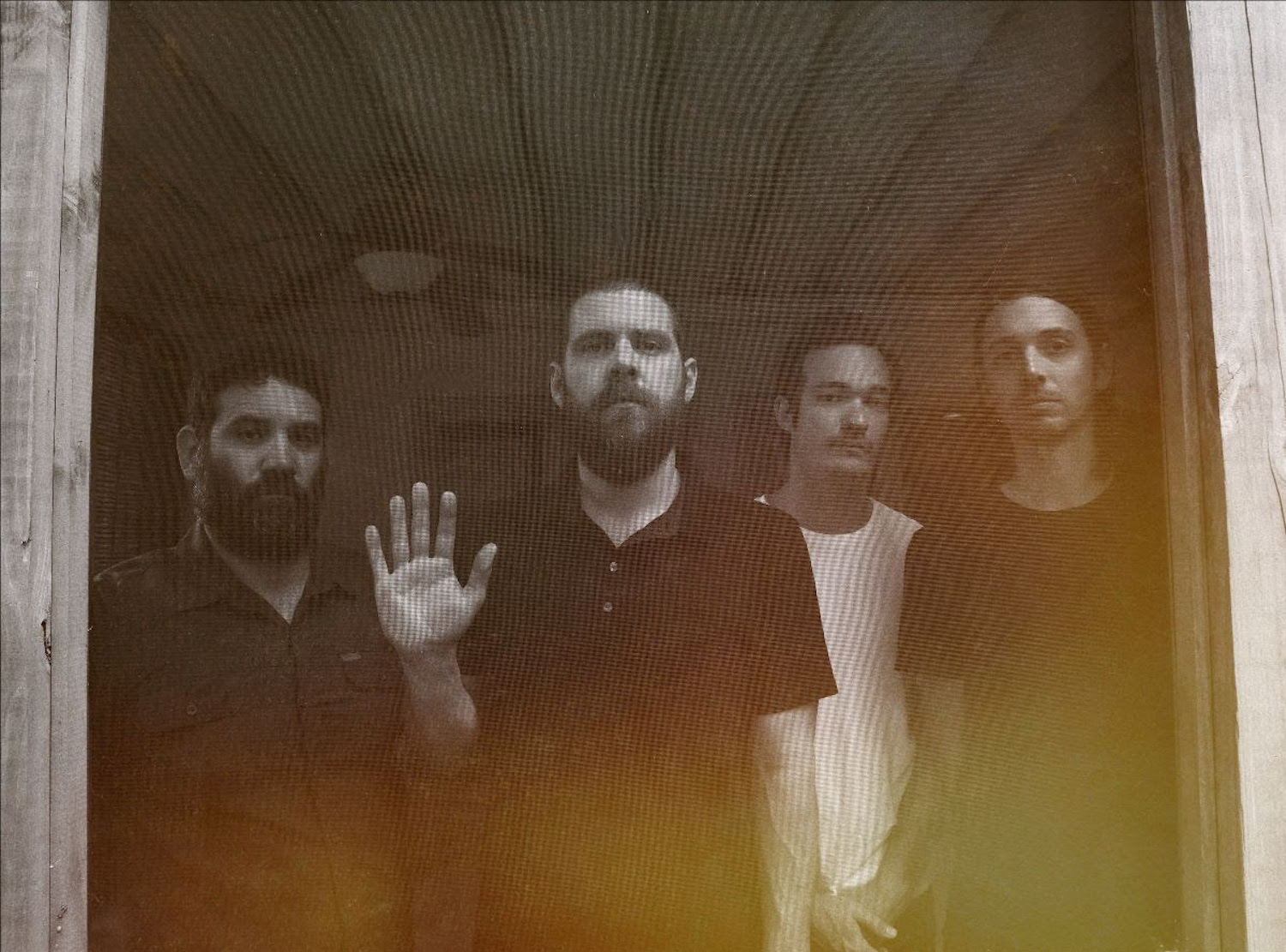 Manchester Orchestra light leak behind door screen