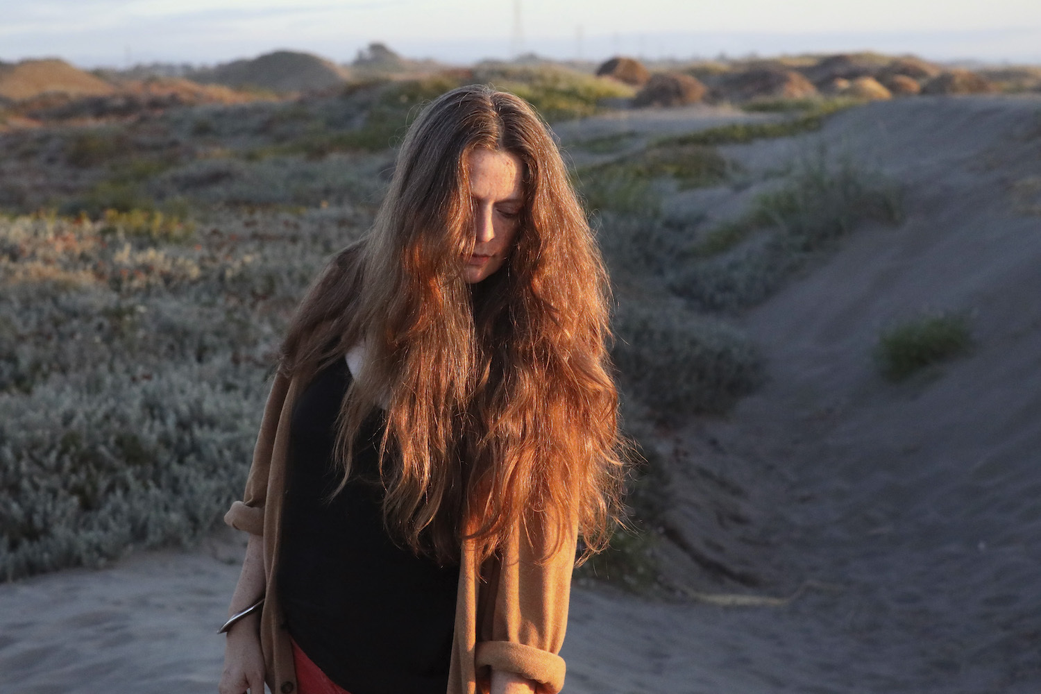 Meg Baird looking down beach