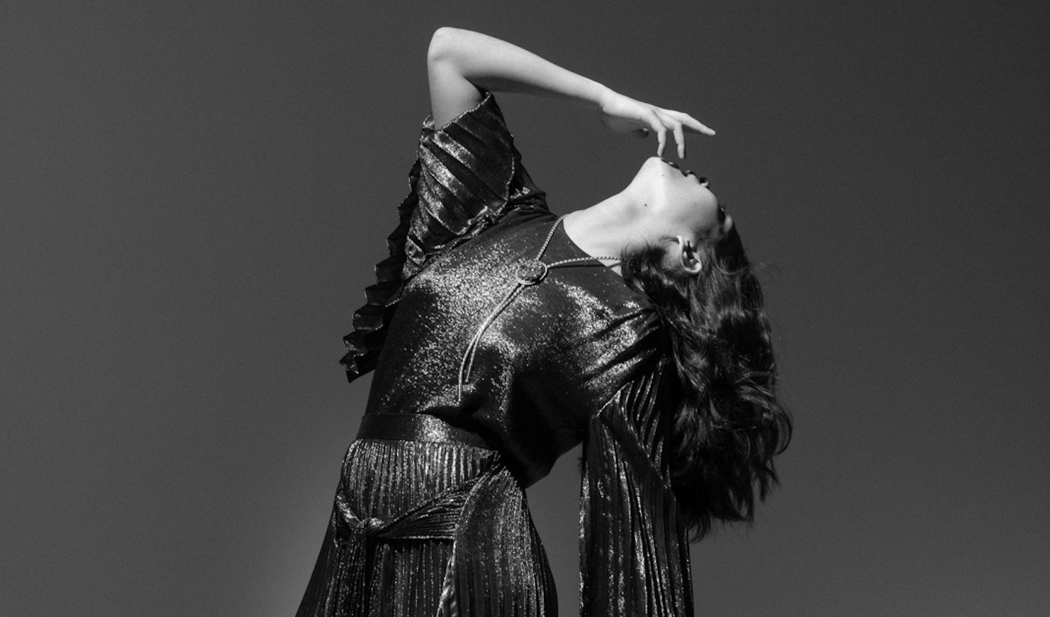 Mitski glitter dress leaning back monochrome Ebru Yildiz