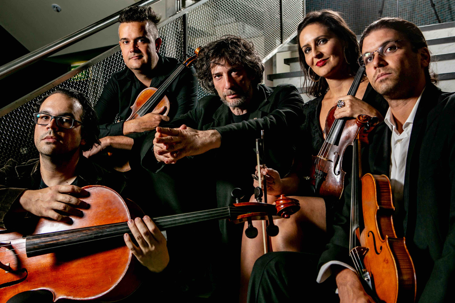 Neil Gaiman Four Play String Quartet sitting on steps