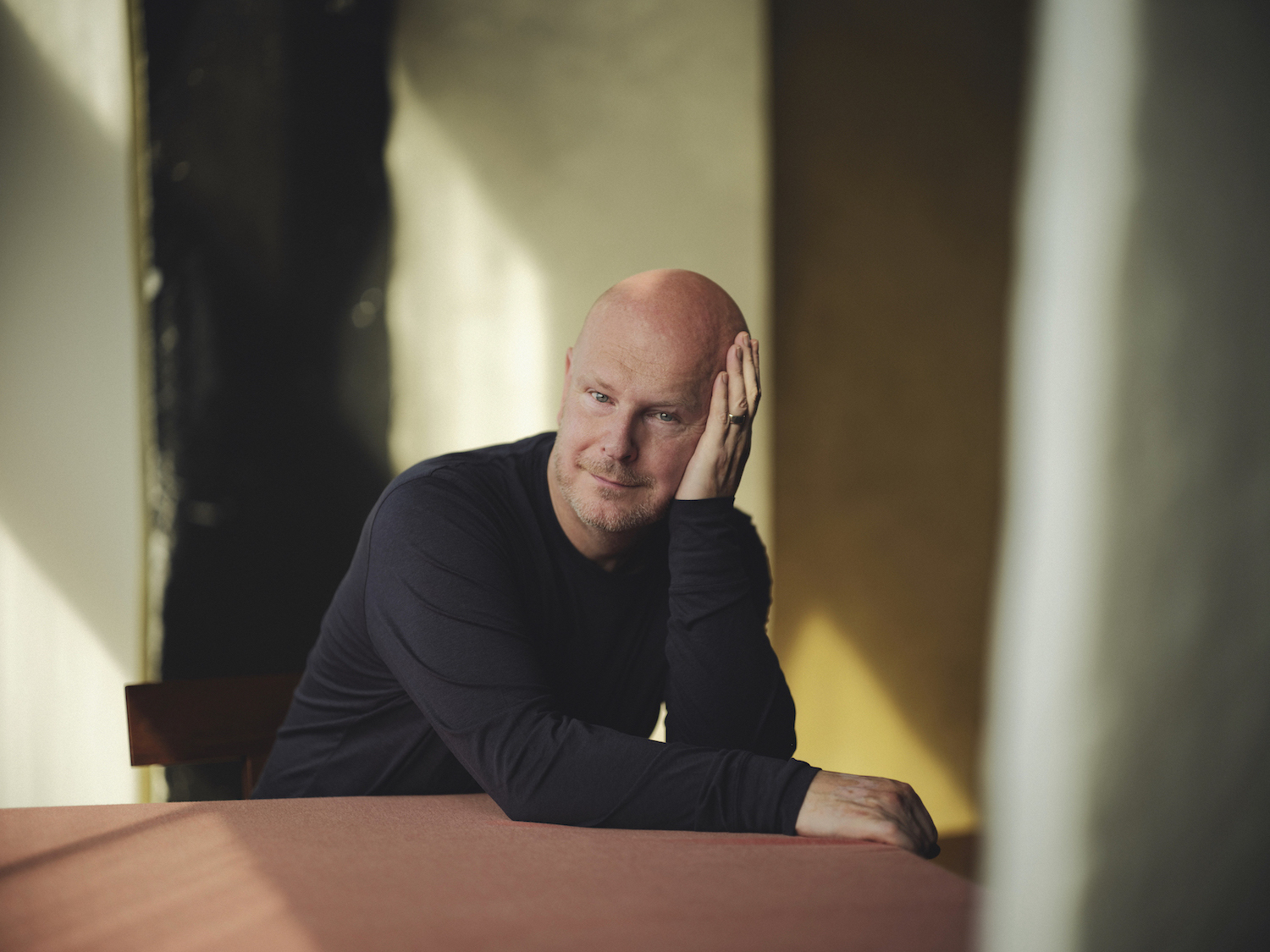 Philip Selway resting head on hand sat at table