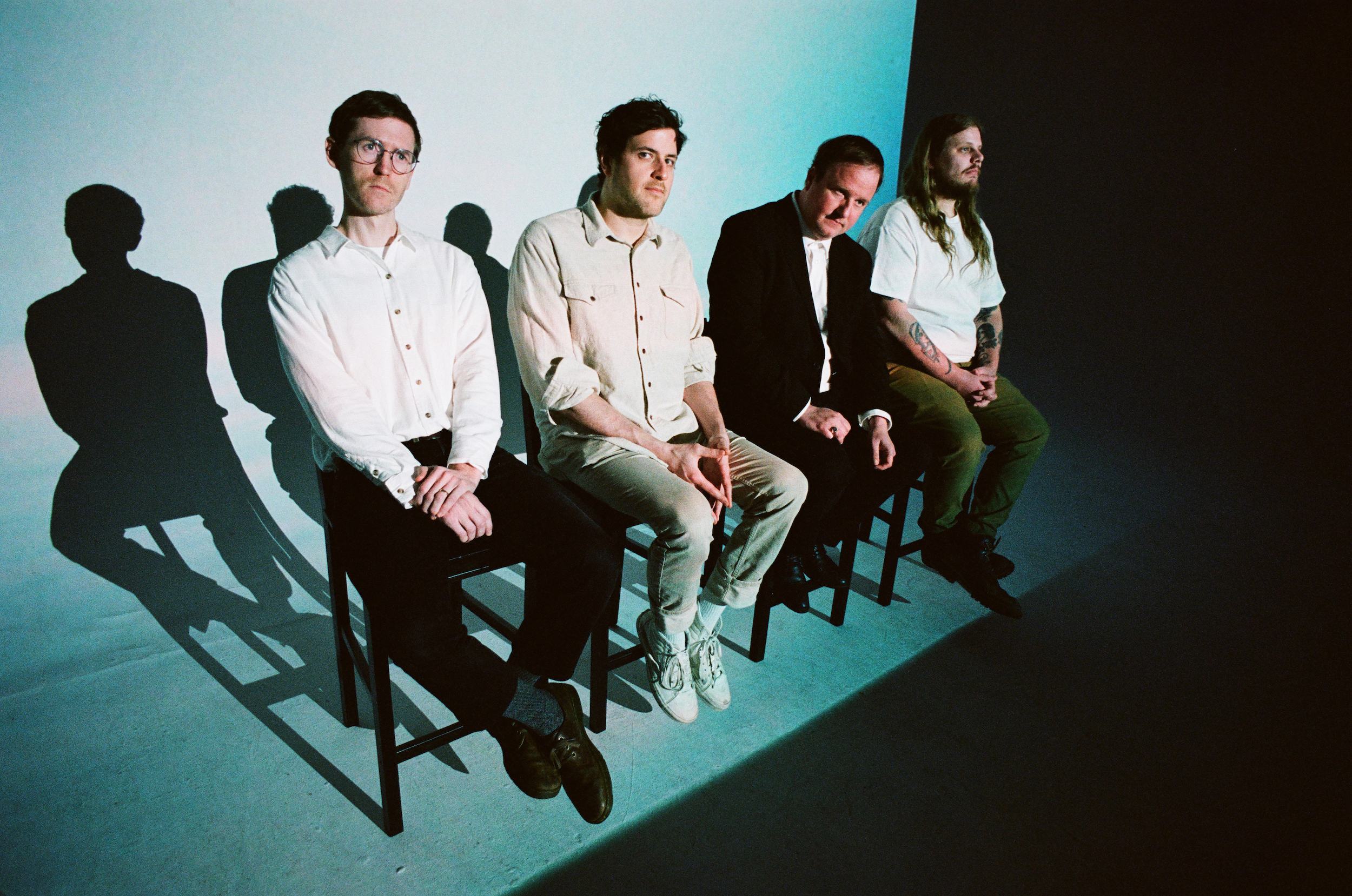 Protomartyr Teal Seated PC Trevor Naud 300dpi