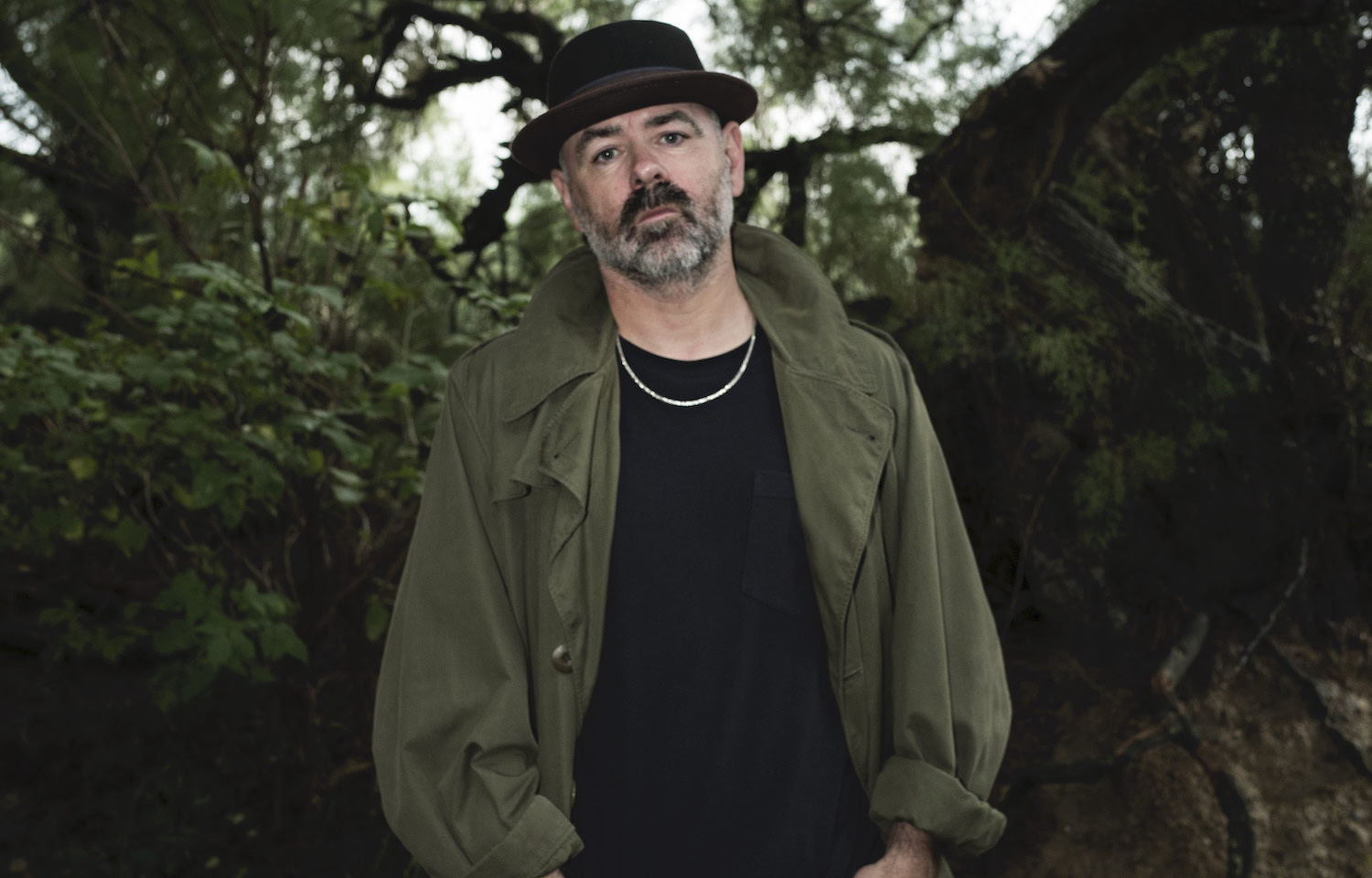 Steve Mason in front of tree green jacket hat