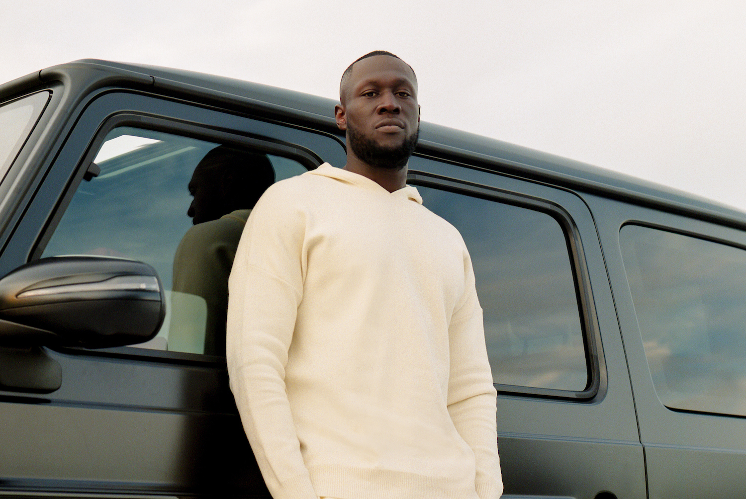 Stormzy stood next to car Ollie Adegboye
