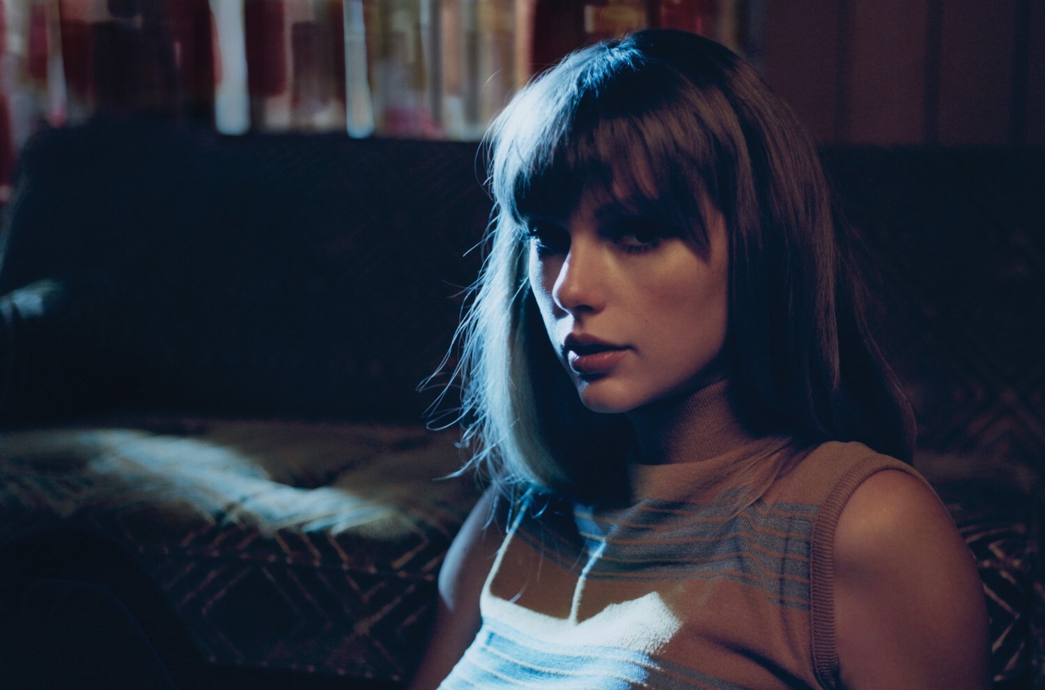Taylor Swift pensive portrait with moonlight coming through curtains