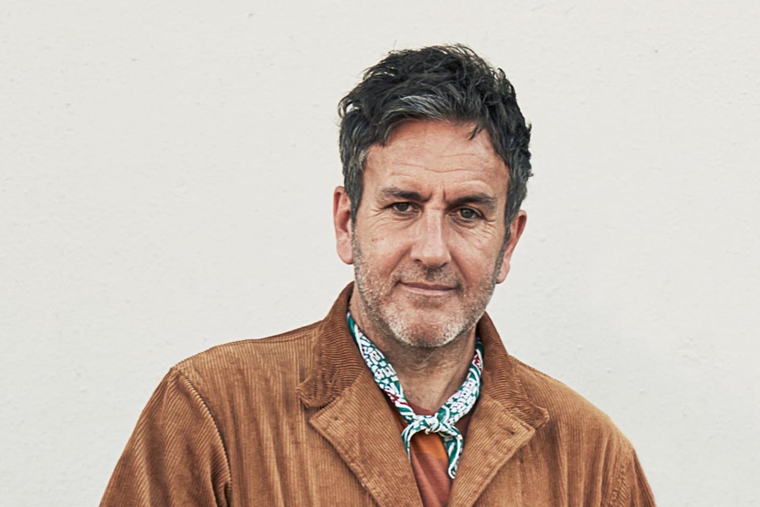 Terry Hall press shot brown jacket