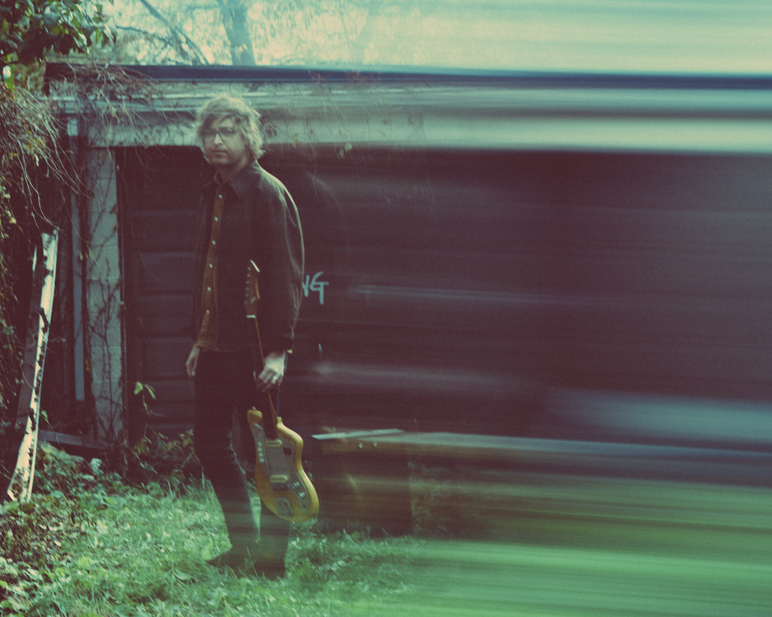 Weird Nightmare blurry holding guitar