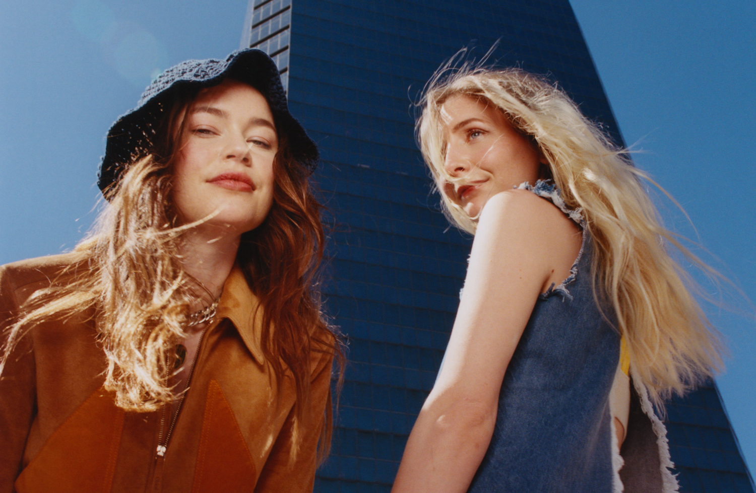 Wet Leg in front of skyscraper