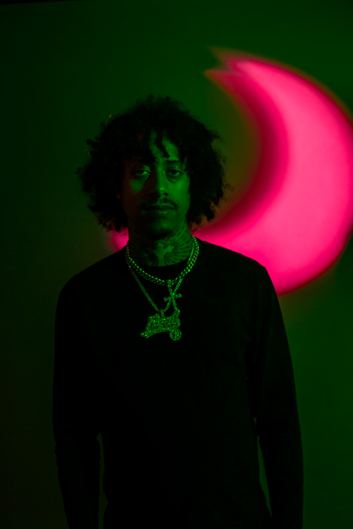 Tony Shnnow against a red moon