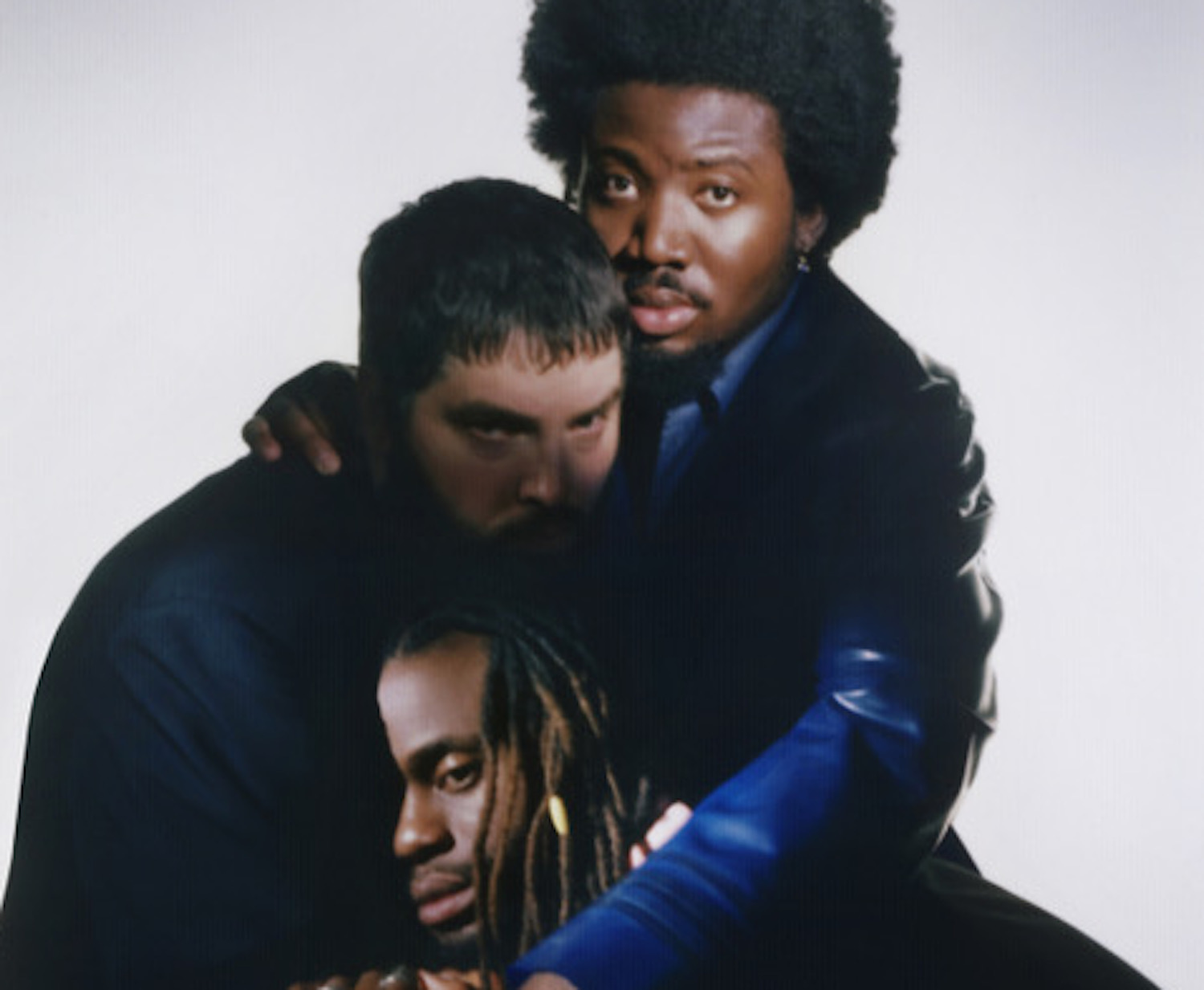 Young Fathers group hug 2022