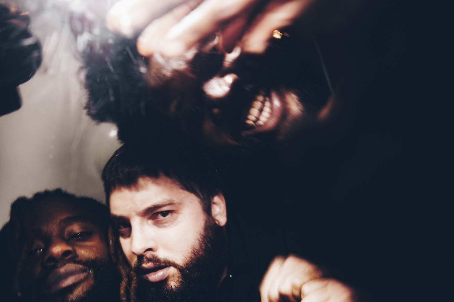 Young Fathers close up group shot 2022