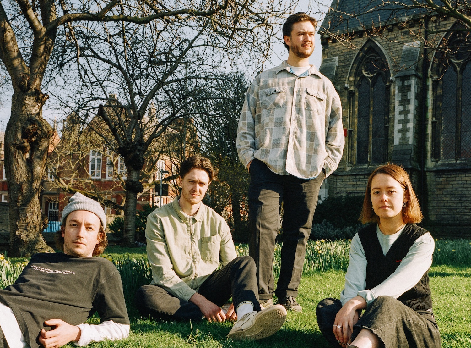 Chartreuse sitting in a church garden for "Satellites" single