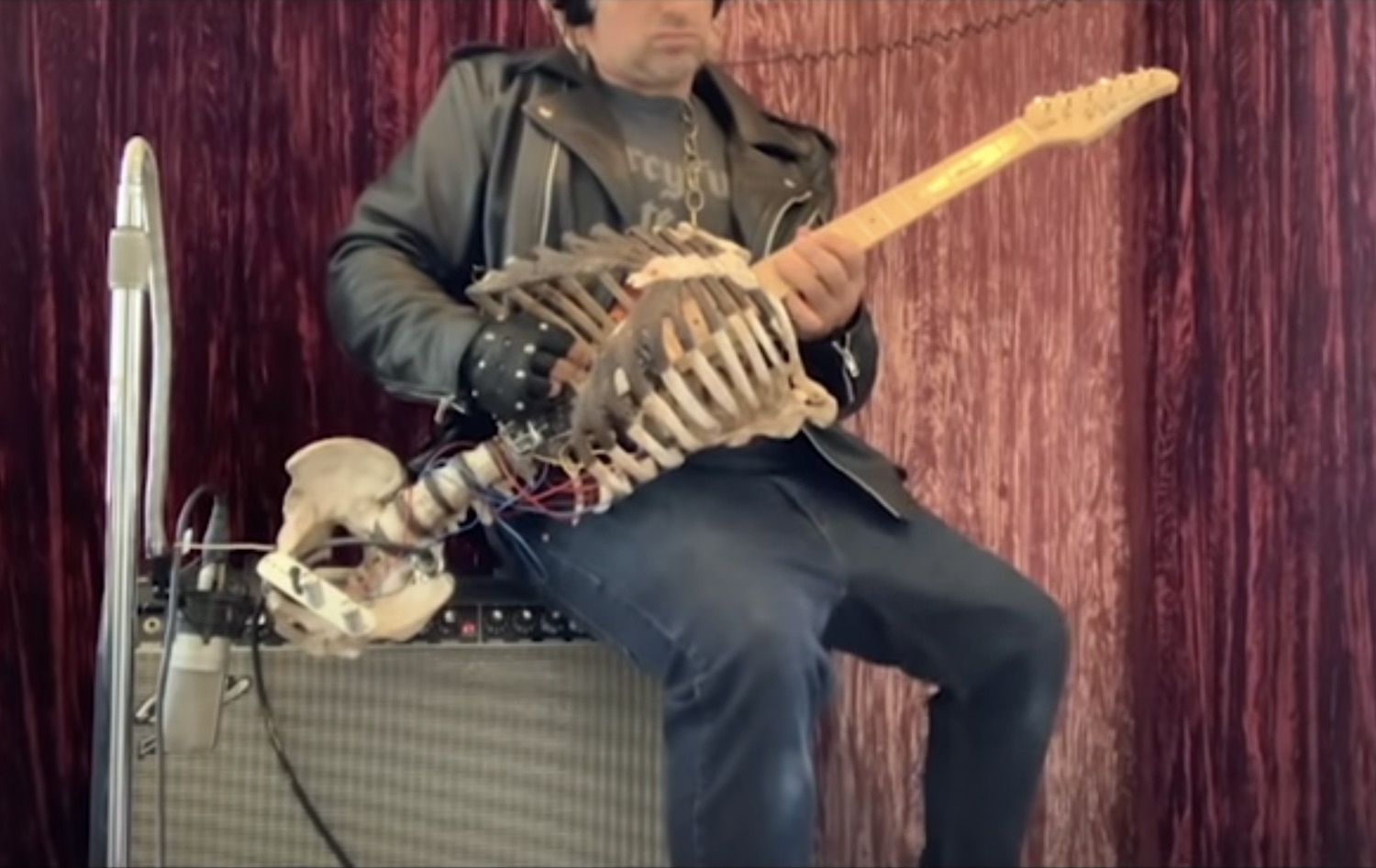 Guy makes guitar out of uncles skeleton metal sucks