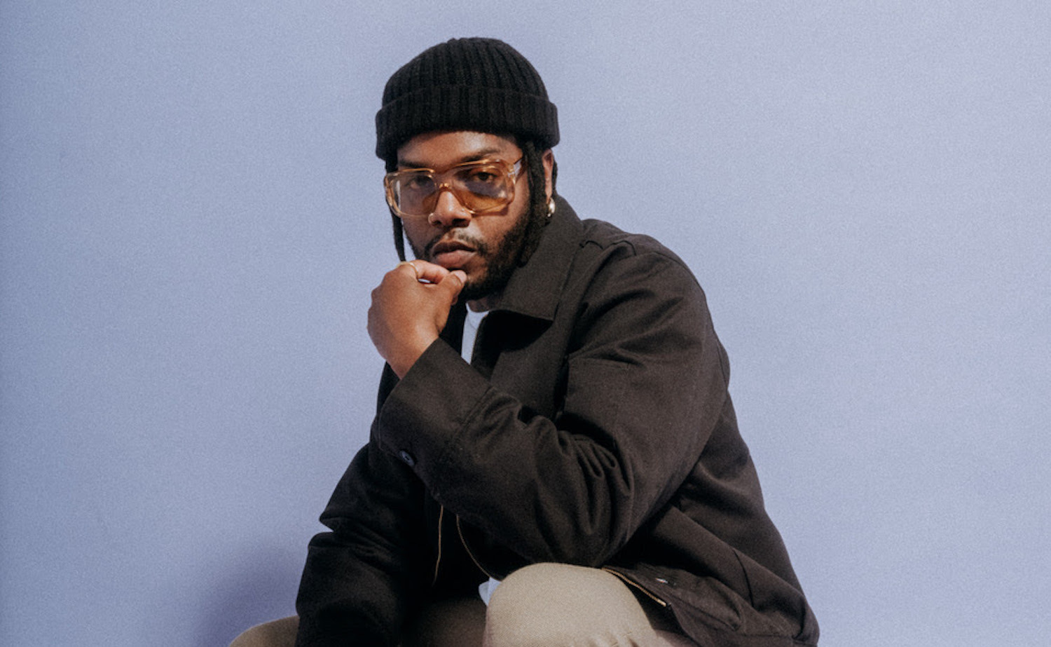Serpentwithfeet beanie crouch purple backdrop