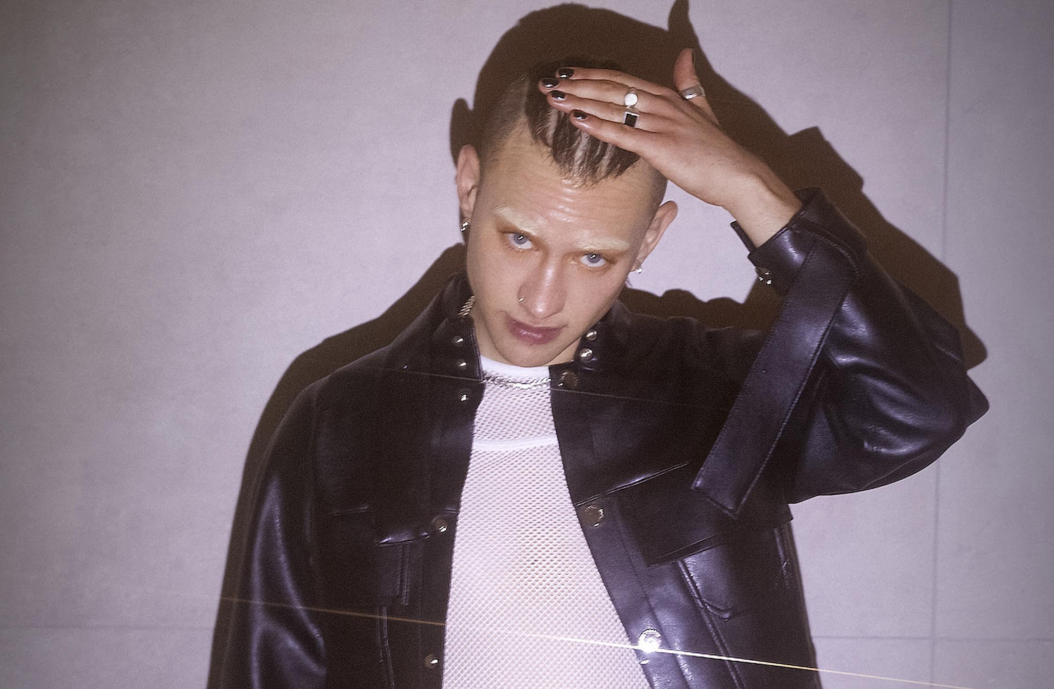 Years and years leather jacket hand on hair