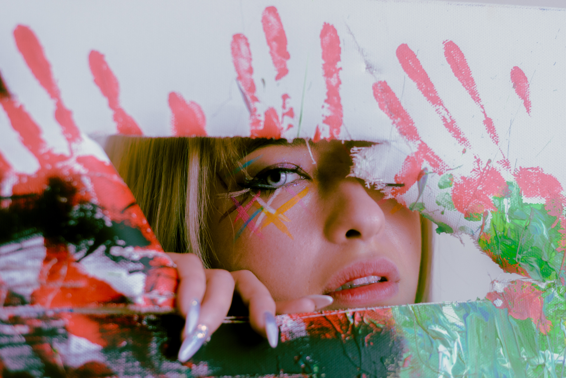 Cryalot looks through a torn painting