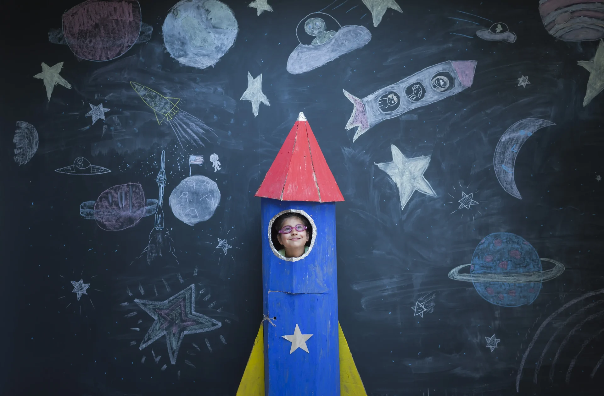 Blast off into creativity with a child in a cardbo 2025 04 04 23 38 04 utc