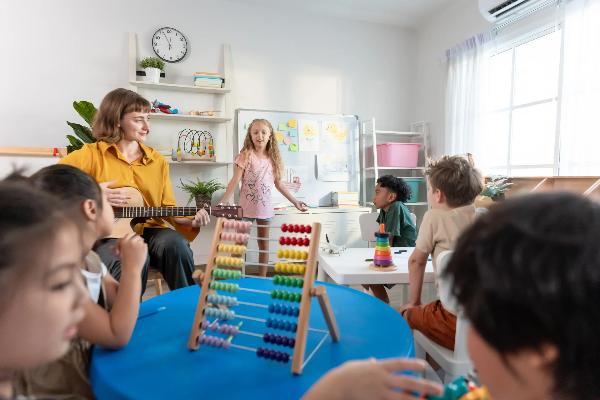 Children Playing With Teacher