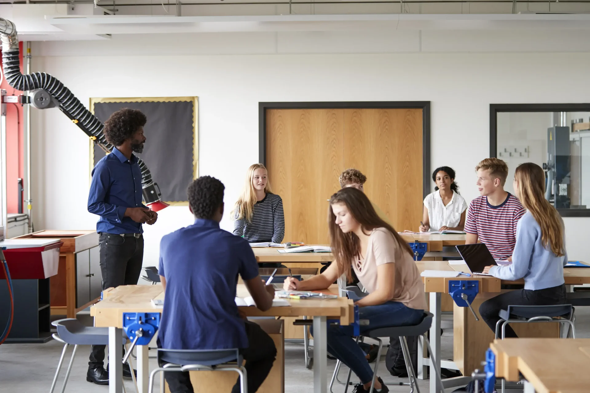 Teacher Teaching Students In Group