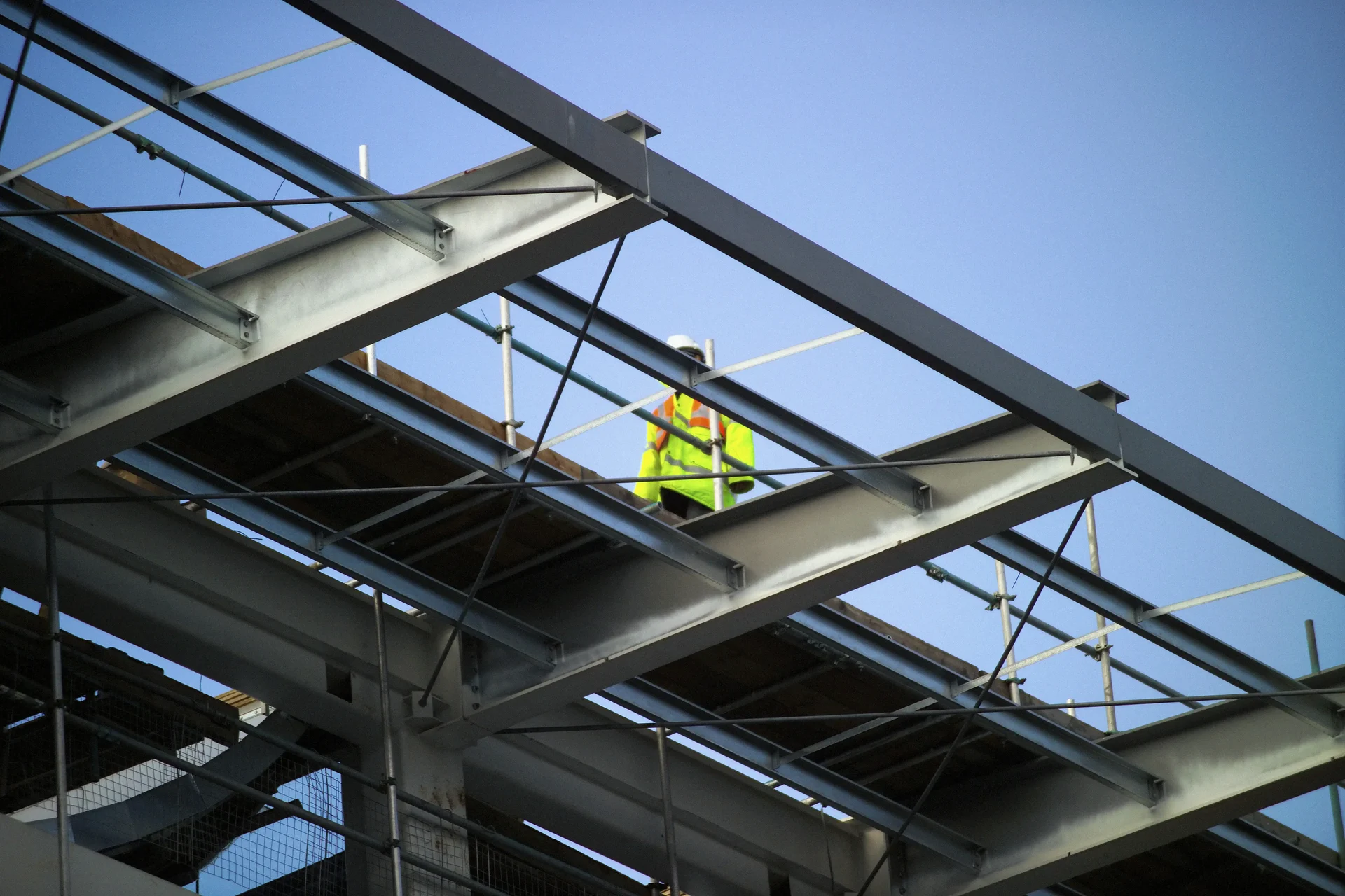 Man walking on girders 2025 04 03 15 18 54 utc