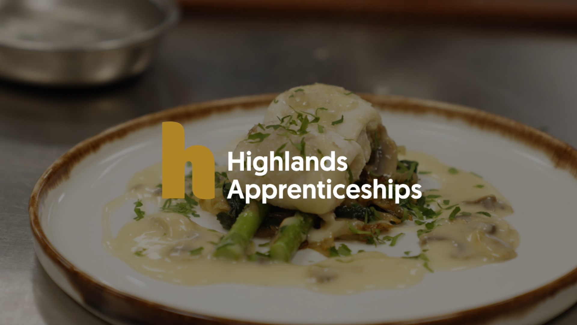 Thumbnail for Highlands Apprenticeships brand video. background shows a gourmet meal made by an apprentice on their course.