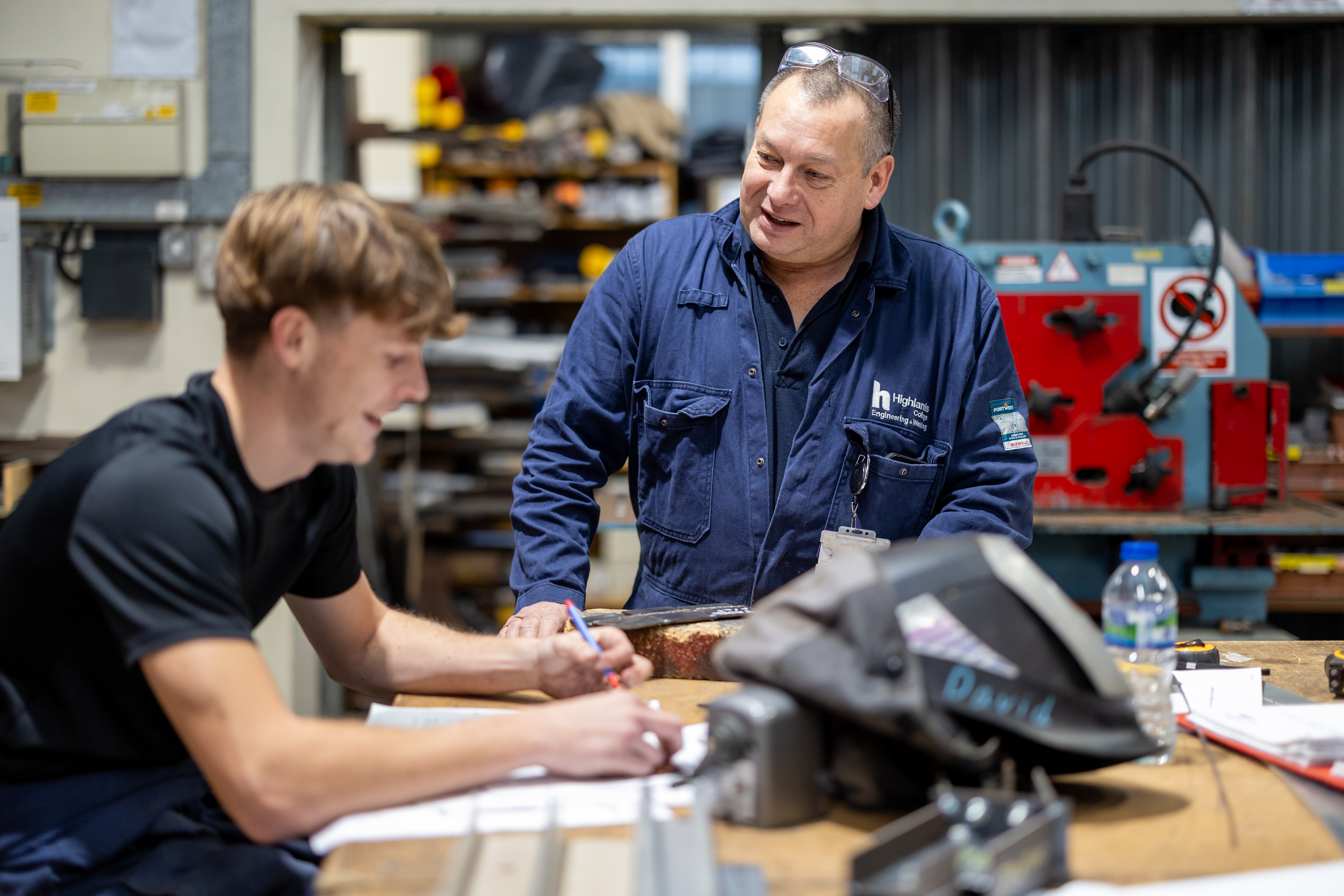 Construction - Student Being Coached at Welding Workshop