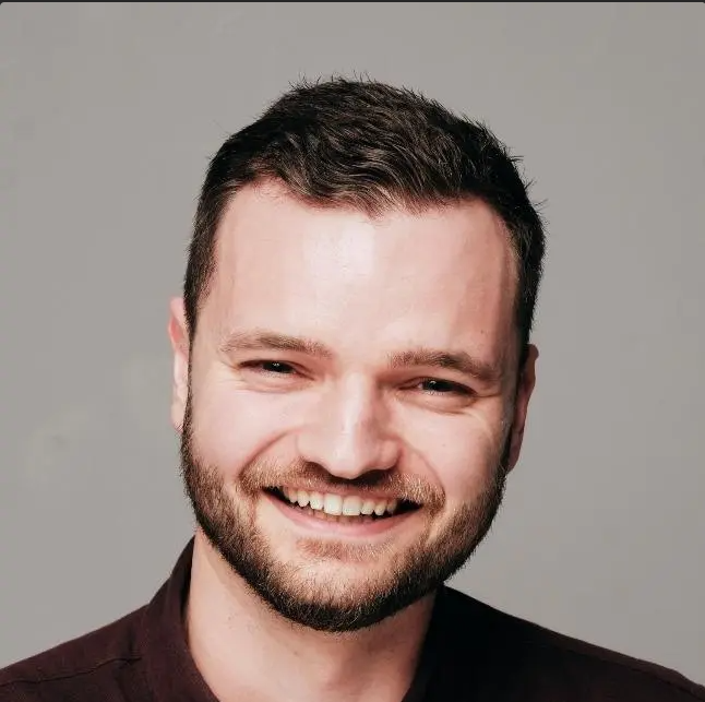 Partners Alumni - Torin Mitchell Smiling at the Camera