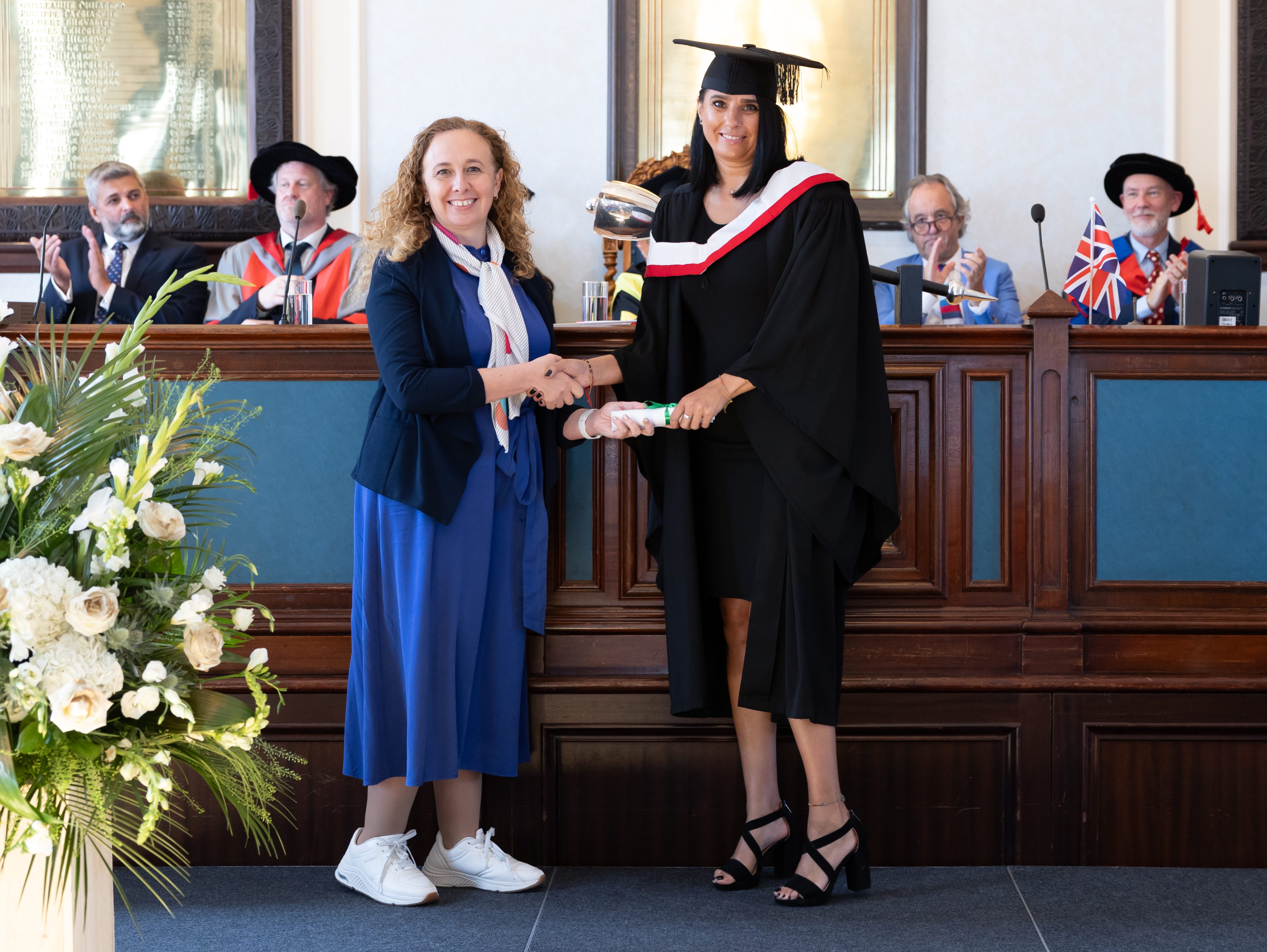 Professional - Female Student on Stage at their Highlands Professional Graduation