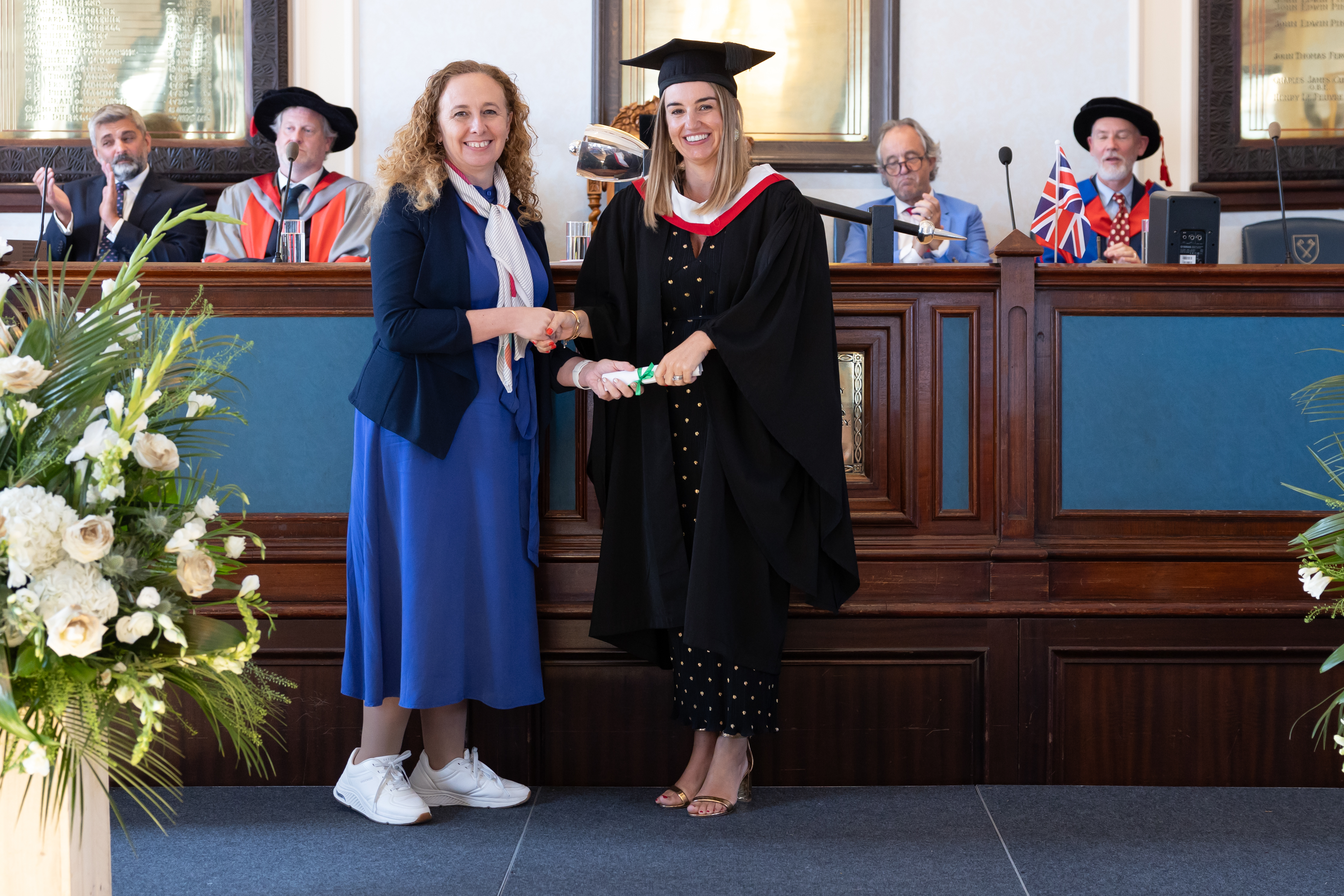 Professional - Female Student on Stage at Their Highlands Professional Graduation