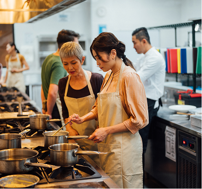 Students in the Kitchen Preparing a Meal