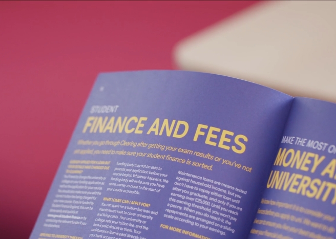 Magazine open on two pages with purple background and yellow writing. The headline reads 'Student Finance and Fees'.