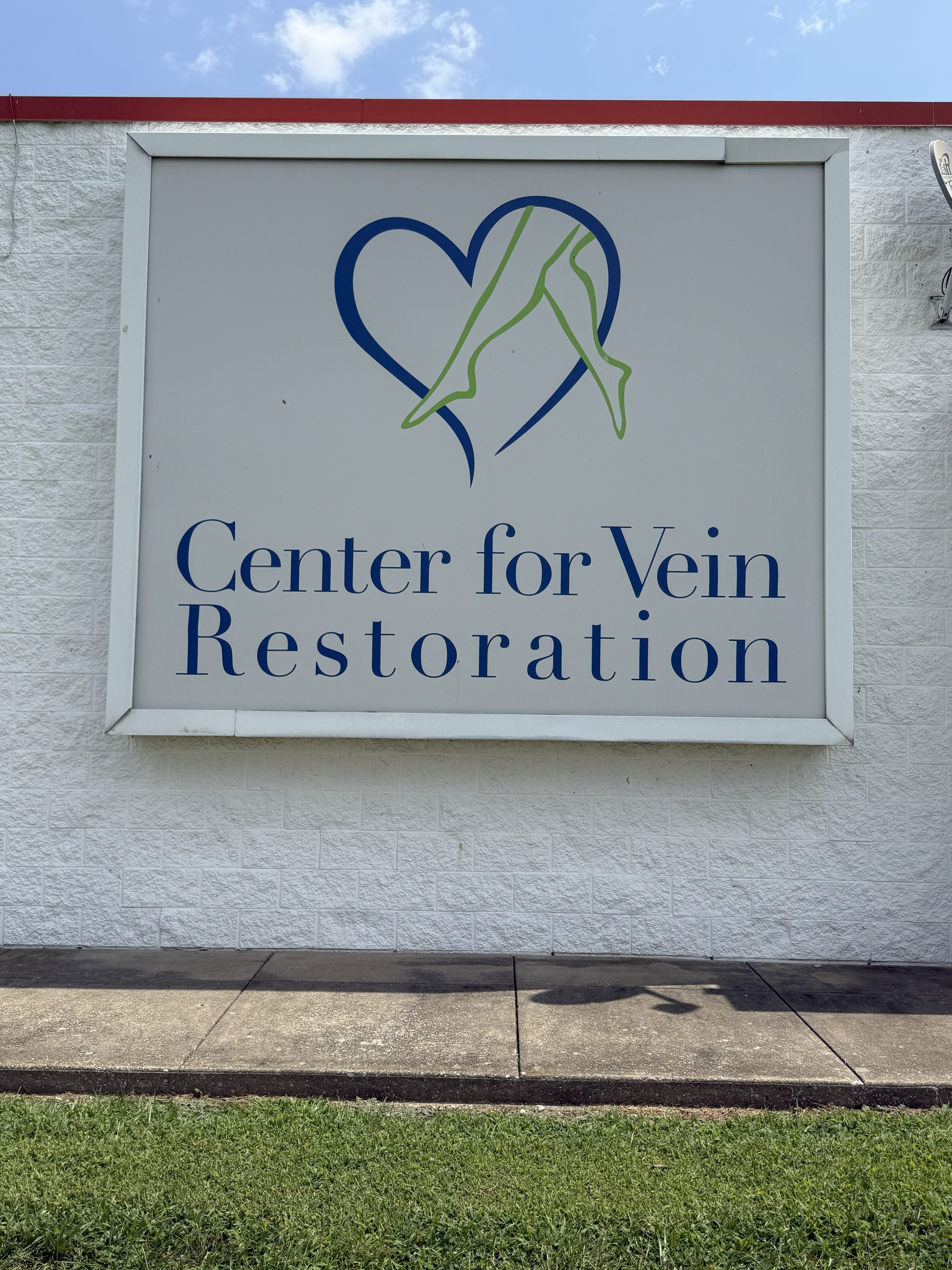 Exterior photo at the Evansville, IN location for Center for Vein Restoration showing the address board