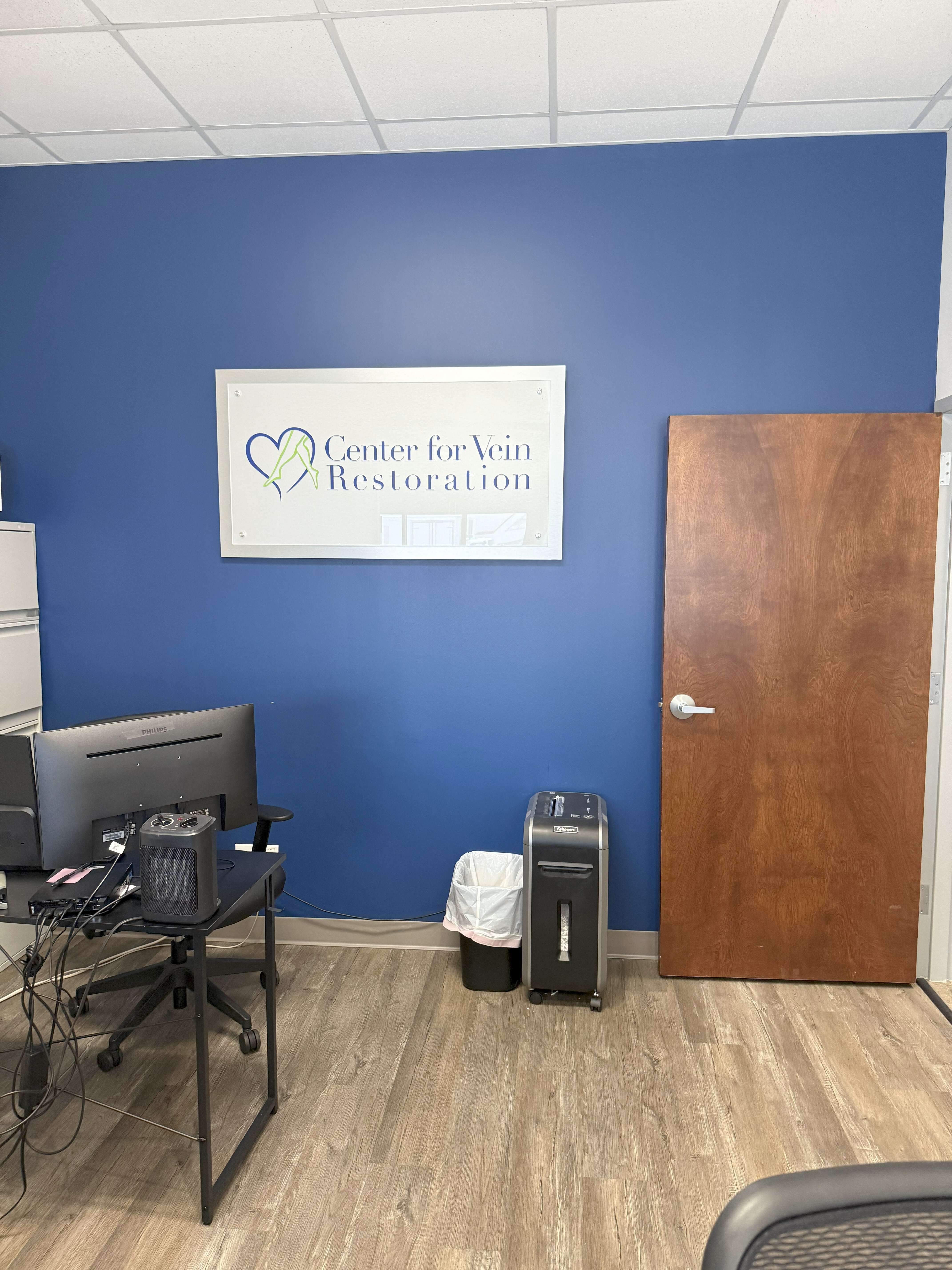 Interior photo at the Evansville, IN location for Center for Vein Restoration showing a patient room