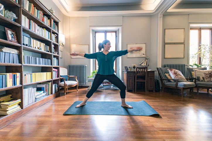 Woman in living room yoga